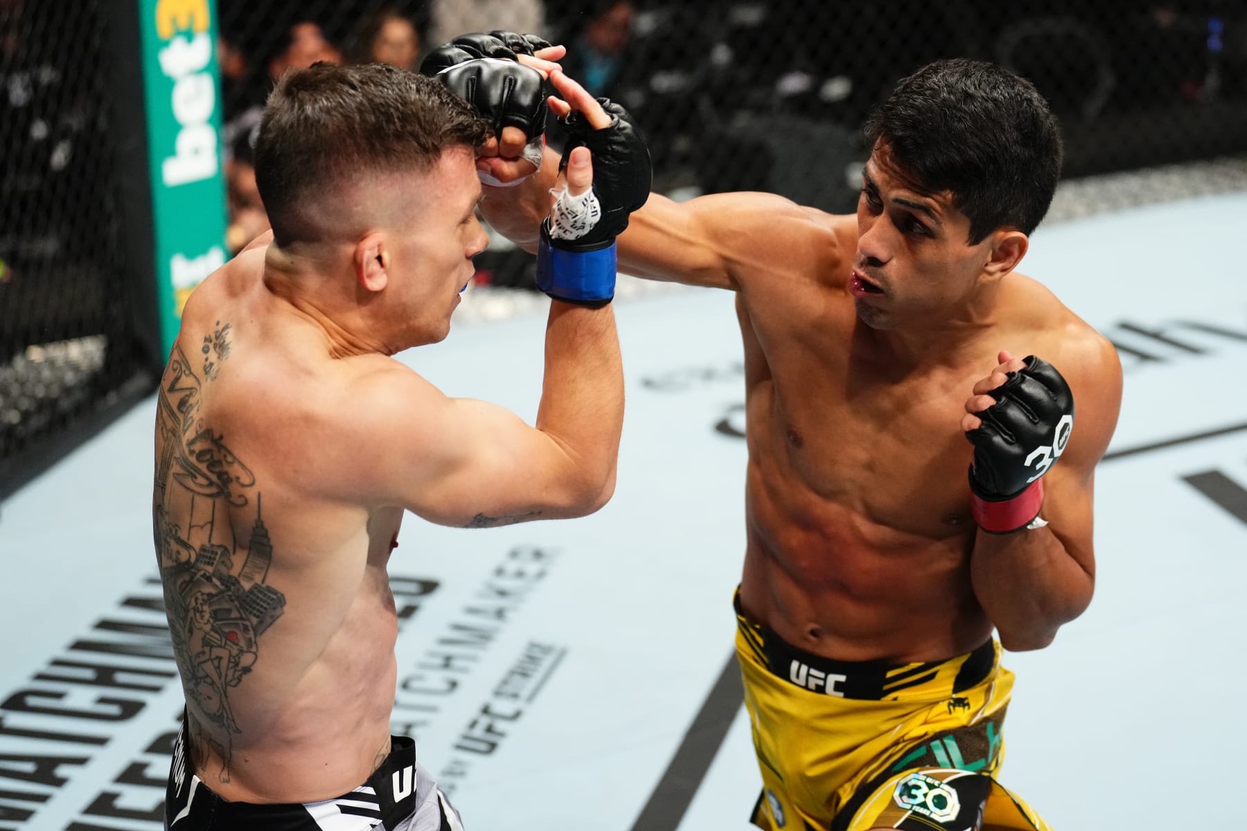 Jafel Filho of Brazil punches Daniel Barez of Spain.