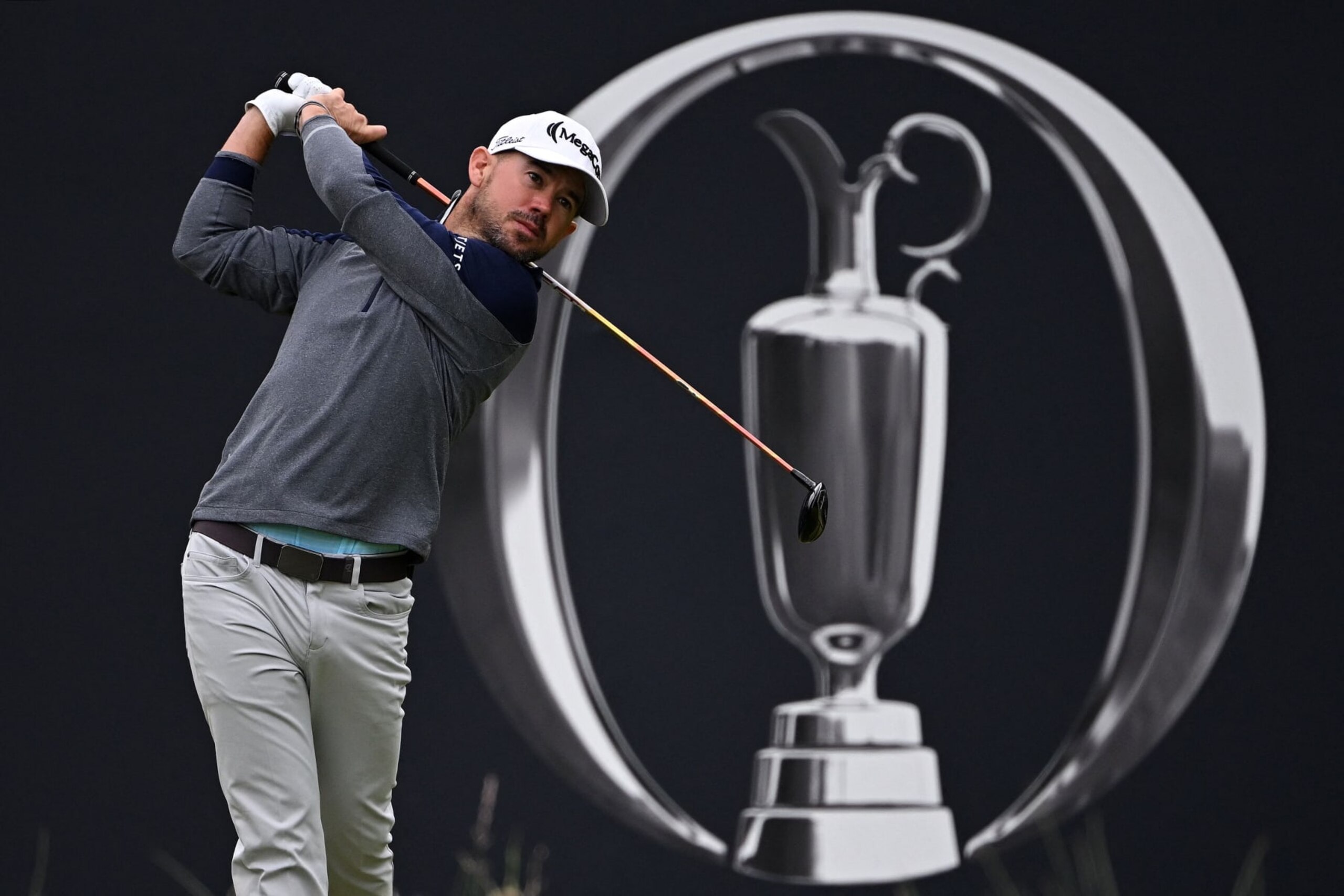 US golfer Brian Harman watches his drive from the 1st tee on day three of the 151st British Open Golf Championship at Royal Liverpool Golf Course in Hoylake, north west England on July 22, 2023. The 151st Open at The Royal Liverpool Golf Course is set to run until July 23. (Photo by Paul ELLIS / AFP) / EDITORIAL USE ONLY (Photo by PAUL ELLIS/AFP via Getty Images)
