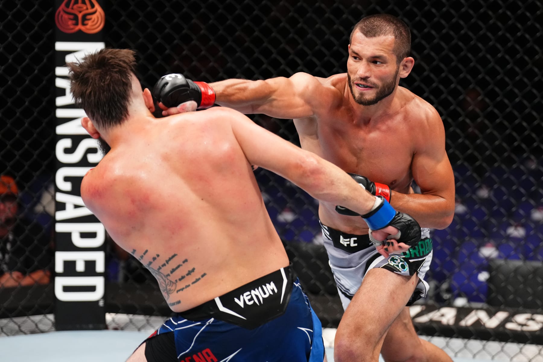 Makhmud Muradov punches Bryan Barberena.