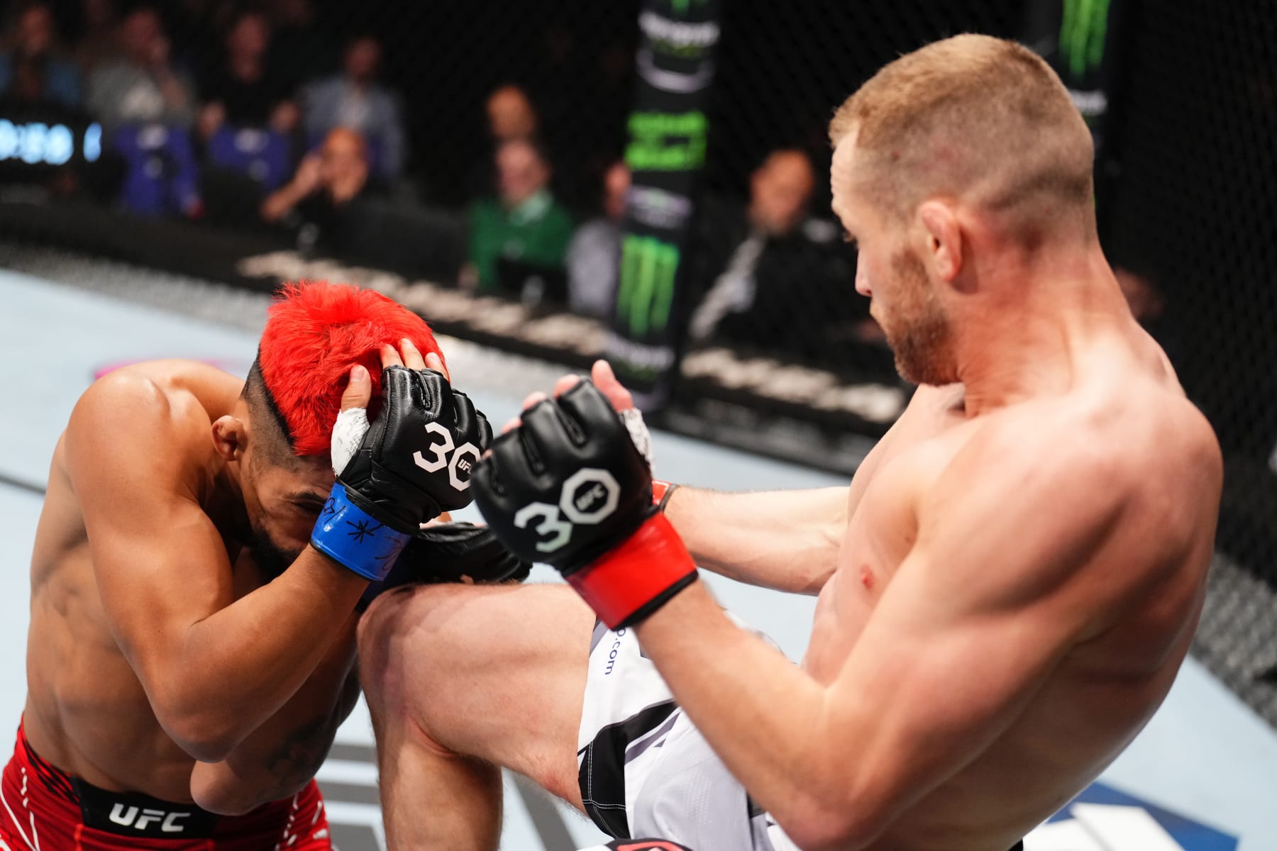 Davey Grant lands a knee on Daniel Marcos.