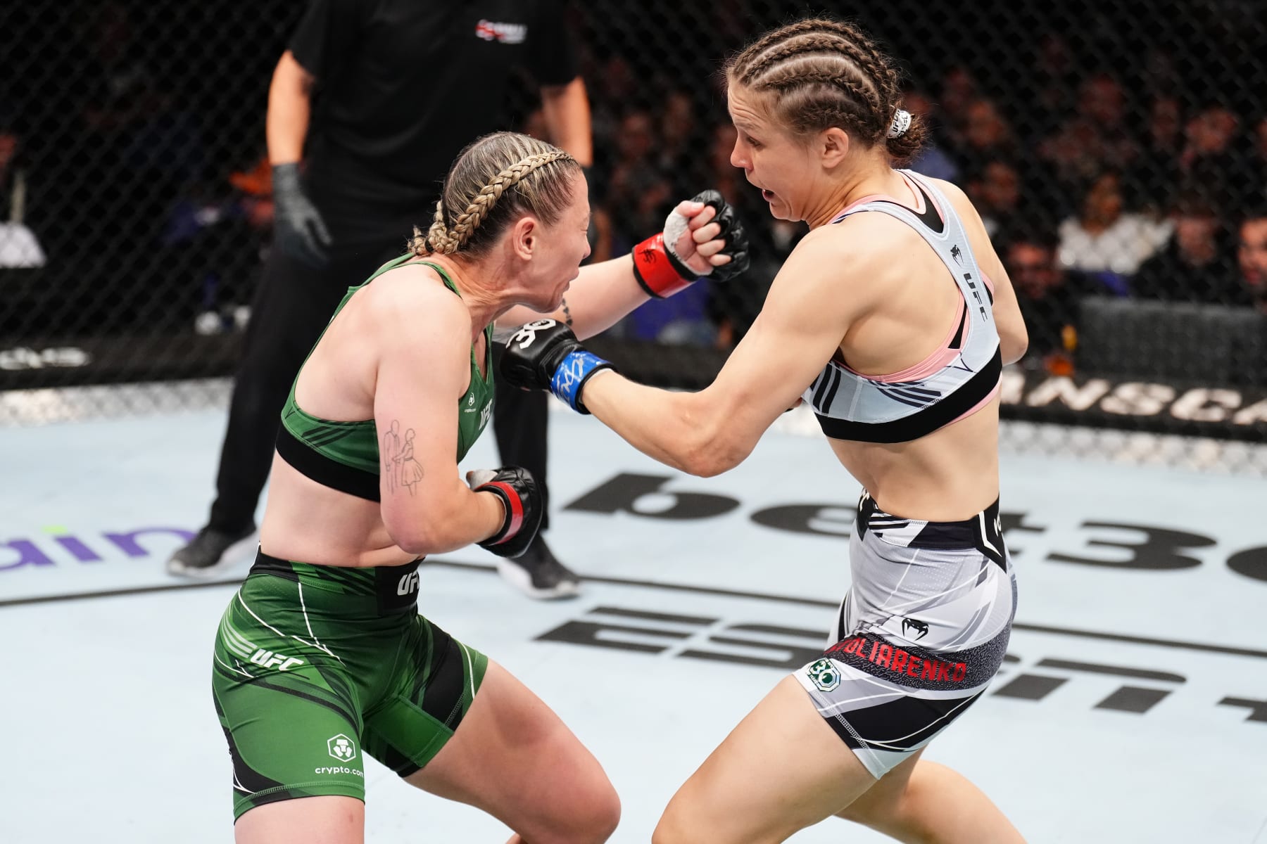 LONDON, ENGLAND - JULY 22: (R-L) Julija Stoliarenko of Lithuania punches Molly McCann of England in their women's flyweight fight during the UFC Fight Night at The O2 Arena on July 22, 2023 in London, England. (Photo by Chris Unger/Zuffa LLC via Getty Images)