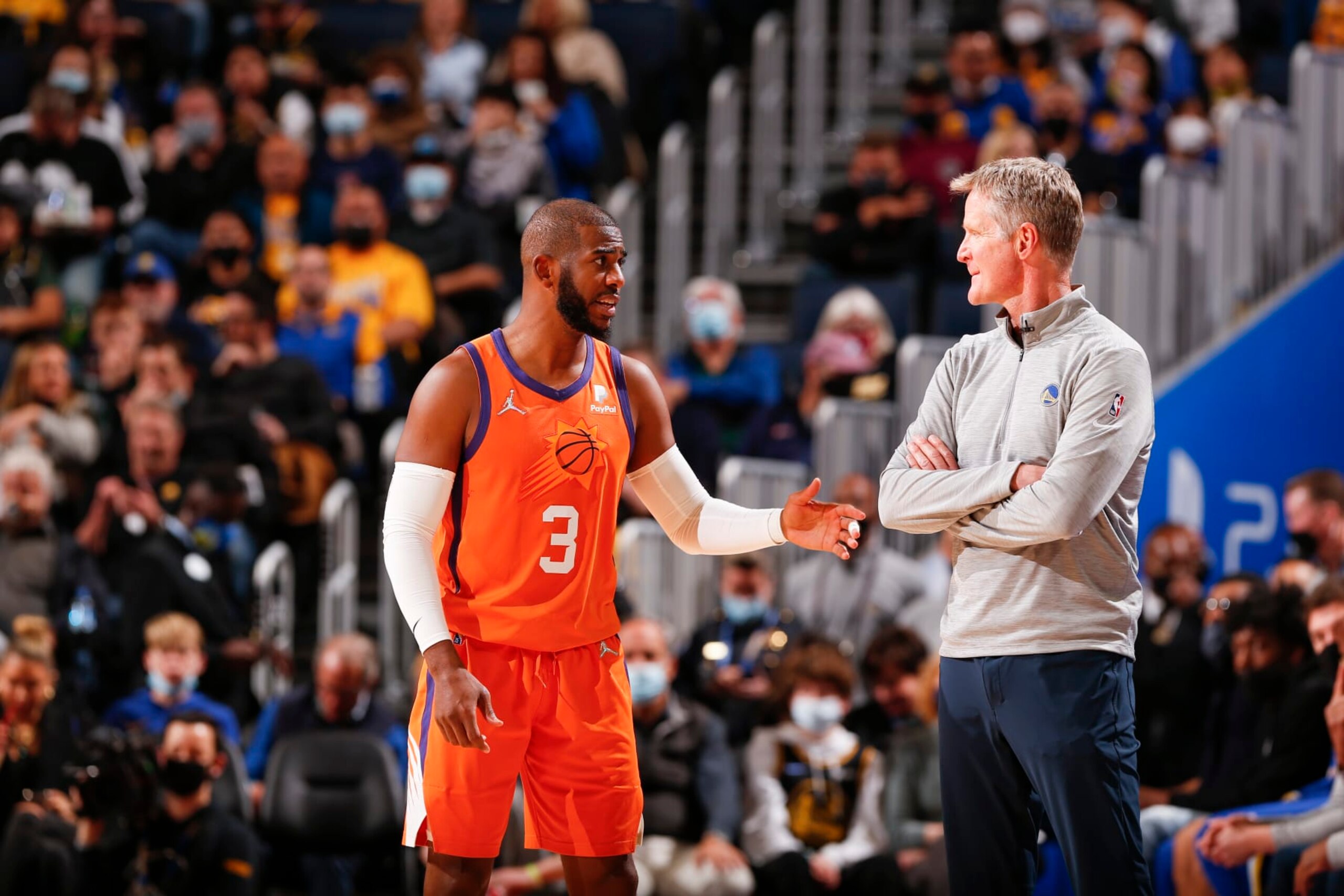 SAN FRANCISCO, CA - DECEMBER 3: Chris Paul #3 of the Phoenix Suns talks to Head Coach Steve Kerr of the Golden State Warriors during the game on December 3, 2021 at Chase Center in San Francisco, California. NOTE TO USER: User expressly acknowledges and agrees that, by downloading and or using this photograph, user is consenting to the terms and conditions of Getty Images License Agreement. Mandatory Copyright Notice: Copyright 2021 NBAE (Photo by Jed Jacobsohn/NBAE via Getty Images)