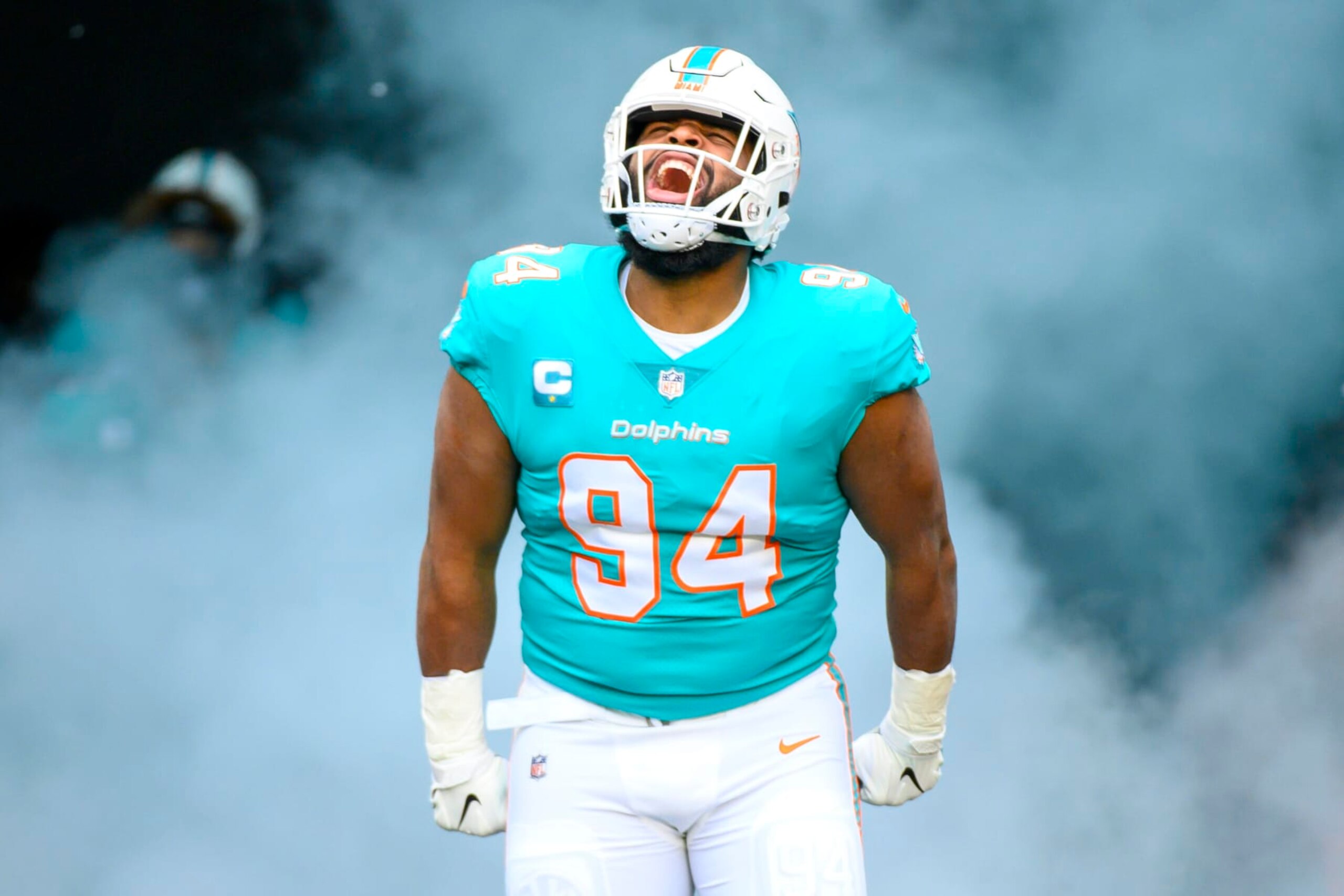 Miami Dolphins defensive tackle Christian Wilkins (94) yells as he is introduced to the fans and runs onto the field before an NFL football game against the Green Bay Packers, Sunday, Dec. 25, 2022, in Miami Gardens, Fla. (AP Photo/Doug Murray)