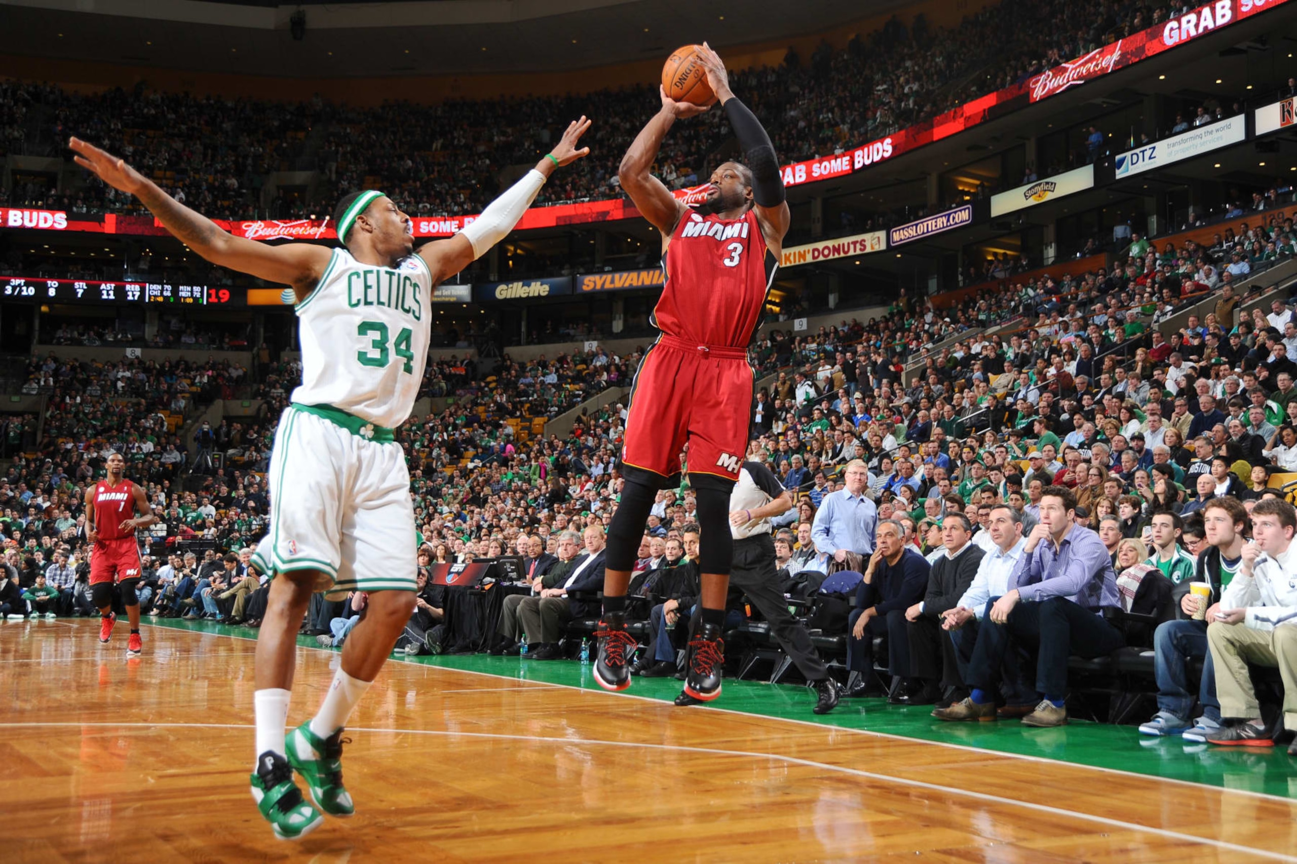 BOSTON, MA - MARCH 18: Dwyane Wade #3 of the Miami Heat shoots the ball against Paul Pierce #34 of the Boston Celtics on March 18, 2013 at the TD Garden in Boston, Massachusetts.  NOTE TO USER: User expressly acknowledges and agrees that, by downloading and or using this photograph, User is consenting to the terms and conditions of the Getty Images License Agreement. Mandatory Copyright Notice: Copyright 2013 NBAE  (Photo by Brian Babineau/NBAE via Getty Images)