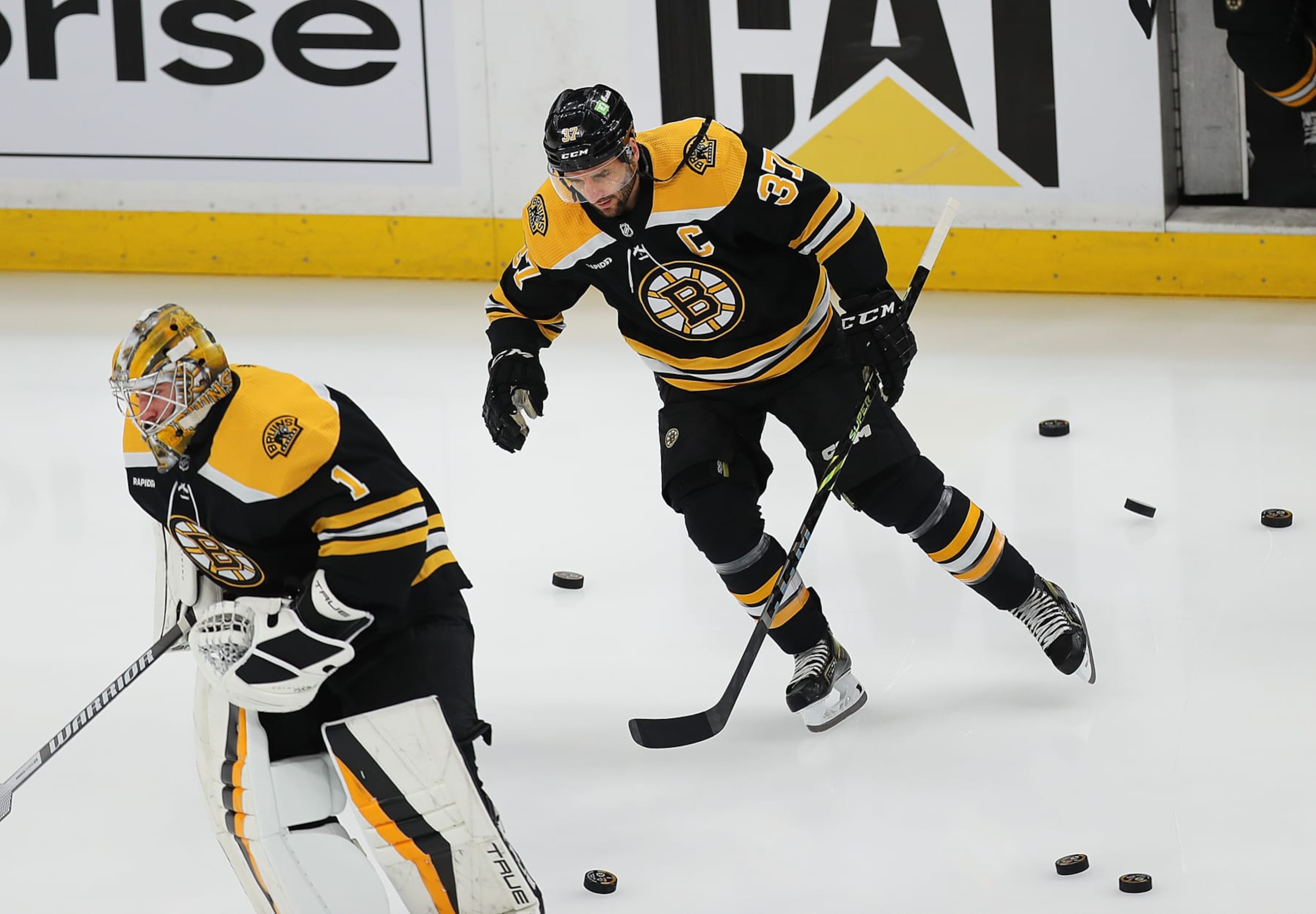 Boston, MA - April 30: Boston Bruins C Patrice Bergeron and goalie Jeremy Swayman hit the ice before the game. The Bruins lost to the Florida Panthers, 4-3, in Game 7 of their Eastern Conference First Round Series. (Photo by John Tlumacki/The Boston Globe via Getty Images)