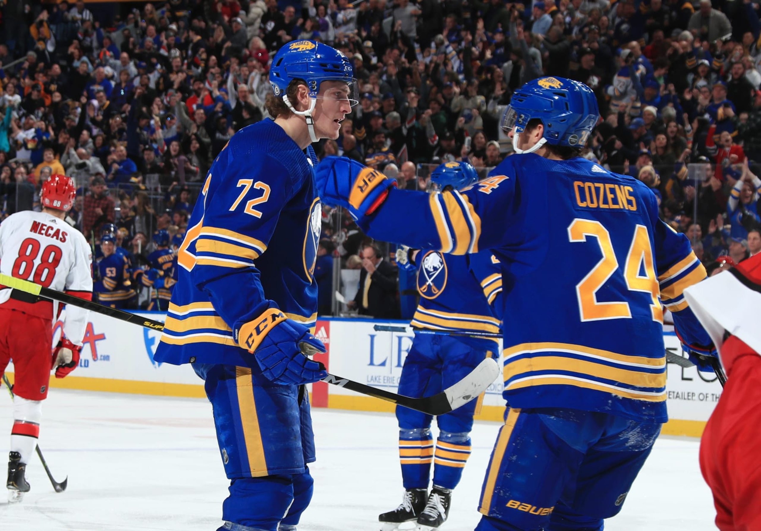 BUFFALO, NY - APRIL 8: Tage Thompson #72 of the Buffalo Sabres celebrates his third period goal against the Carolina Hurricanes with Dylan Cozens #24 during an NHL game on April 8, 2023 at KeyBank Center in Buffalo, New York. (Photo by Bill Wippert/NHLI via Getty Images)