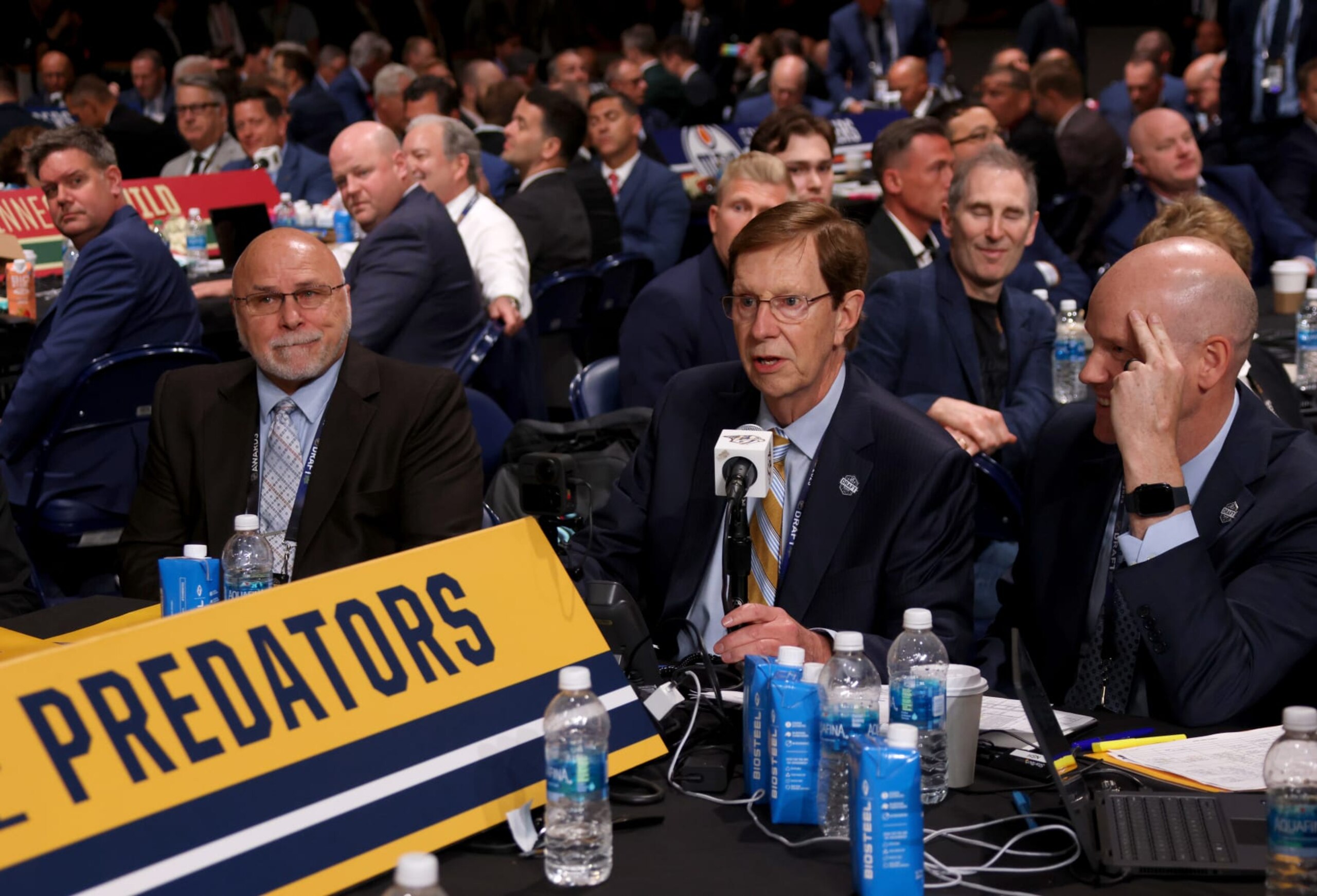 NASHVILLE, TENNESSEE - JUNE 29: General manager David Poile of the Nashville Predators makes his last pick of his career next to Barry Trotz in the 2023 Upper Deck NHL Draft - Rounds 2-7 at Bridgestone Arena on June 29, 2023 in Nashville, Tennessee. (Photo by Dave Sandford/NHLI via Getty Images)