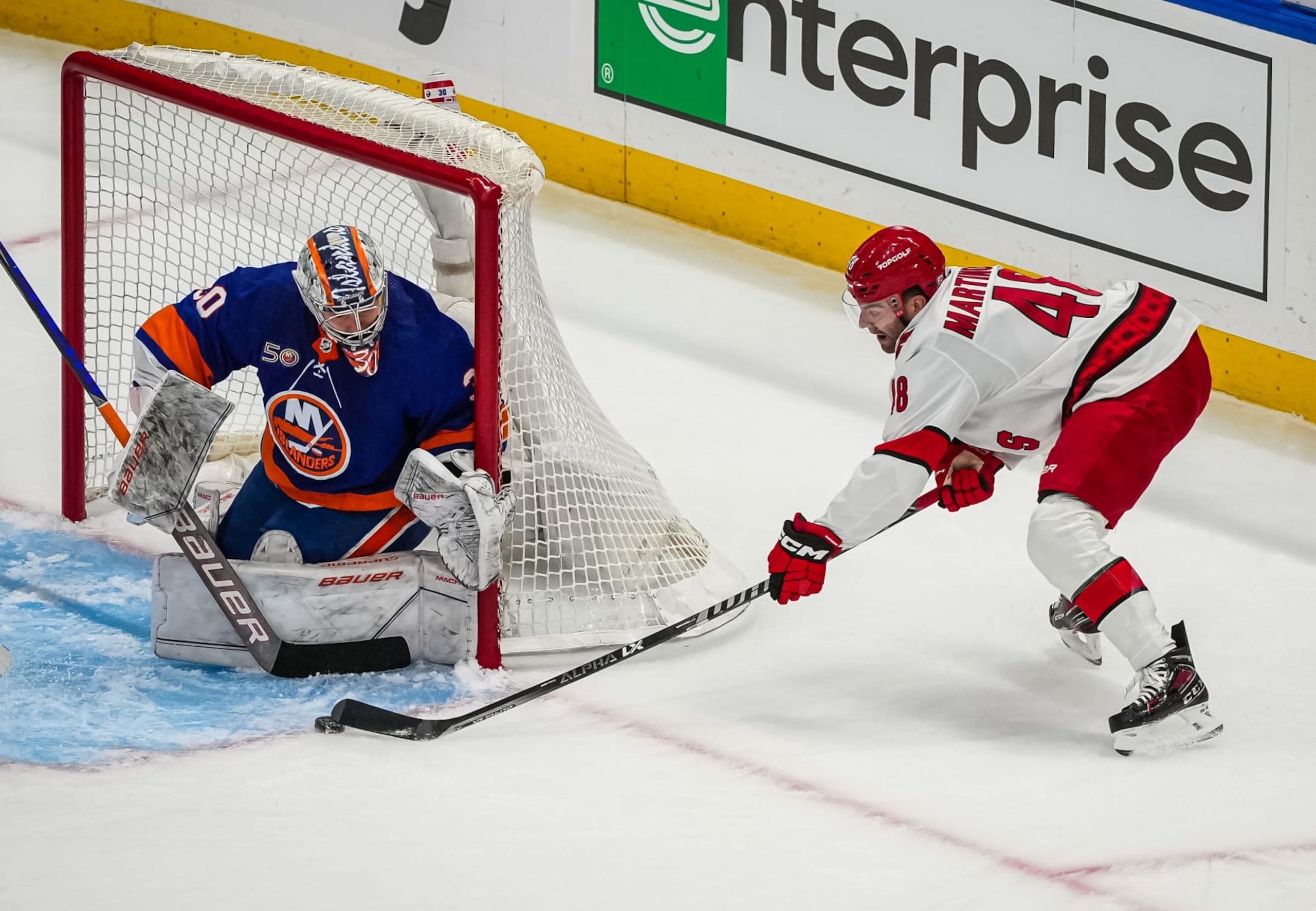 ELMONT, NEW YORK - APRIL 21: Ilya Sorokin #30 of the New York Islanders makes a save against Jordan Martinook #48 of the Carolina Hurricanes during the first period in Game Three of the First Round of the 2023 Stanley Cup Playoffs at UBS Arena on April 21, 2023 in Elmont, New York. (Photo by Josh Lavallee/NHLI via Getty Images)