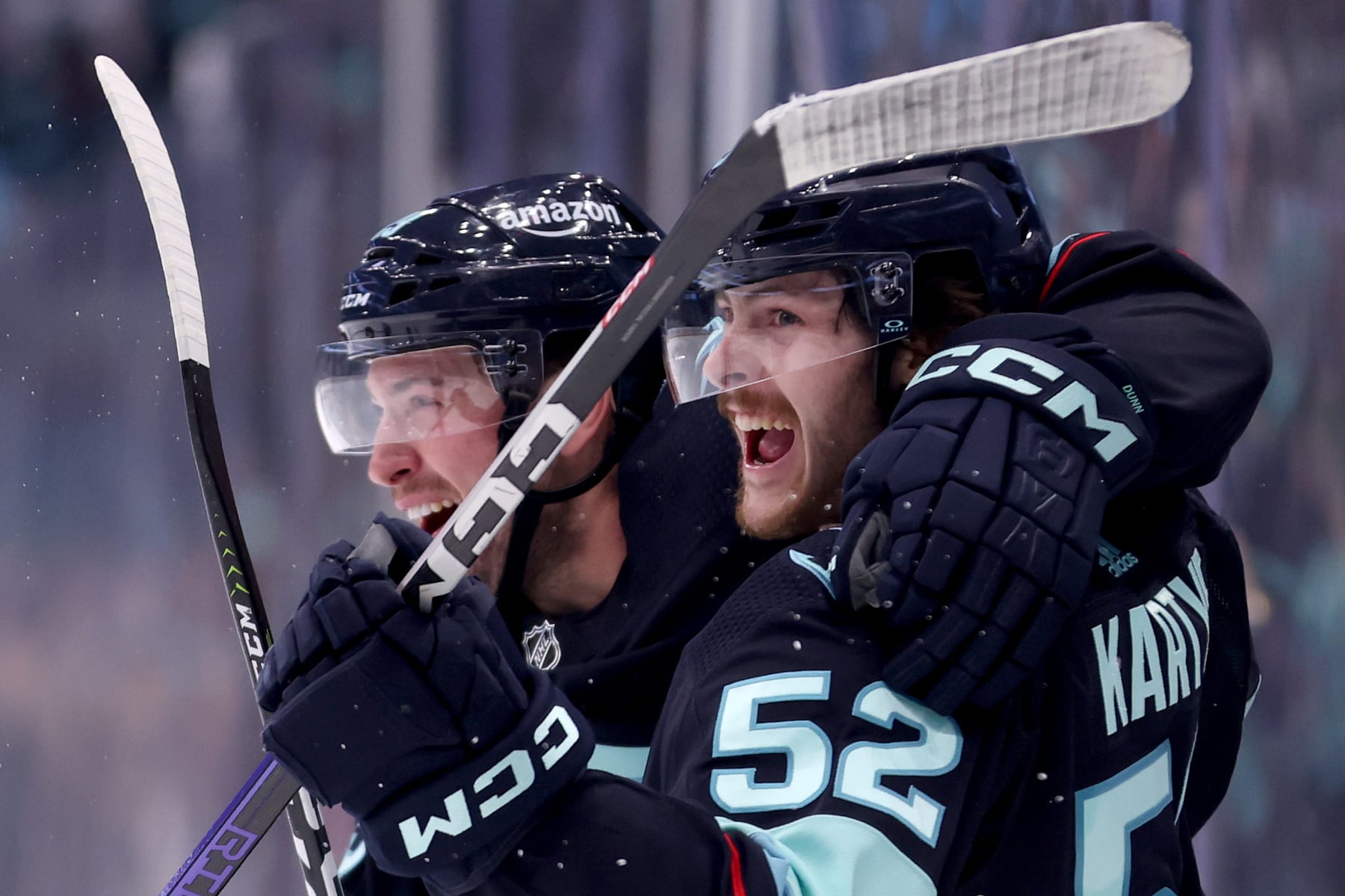 SEATTLE, WASHINGTON - MAY 13: Vince Dunn #29 and Tye Kartye #52 of the Seattle Kraken celebrate a goal by Kartye during the second period against the Dallas Stars in Game Six of the Second Round of the 2023 Stanley Cup Playoffs at Climate Pledge Arena on May 13, 2023 in Seattle, Washington. (Photo by Steph Chambers/Getty Images)