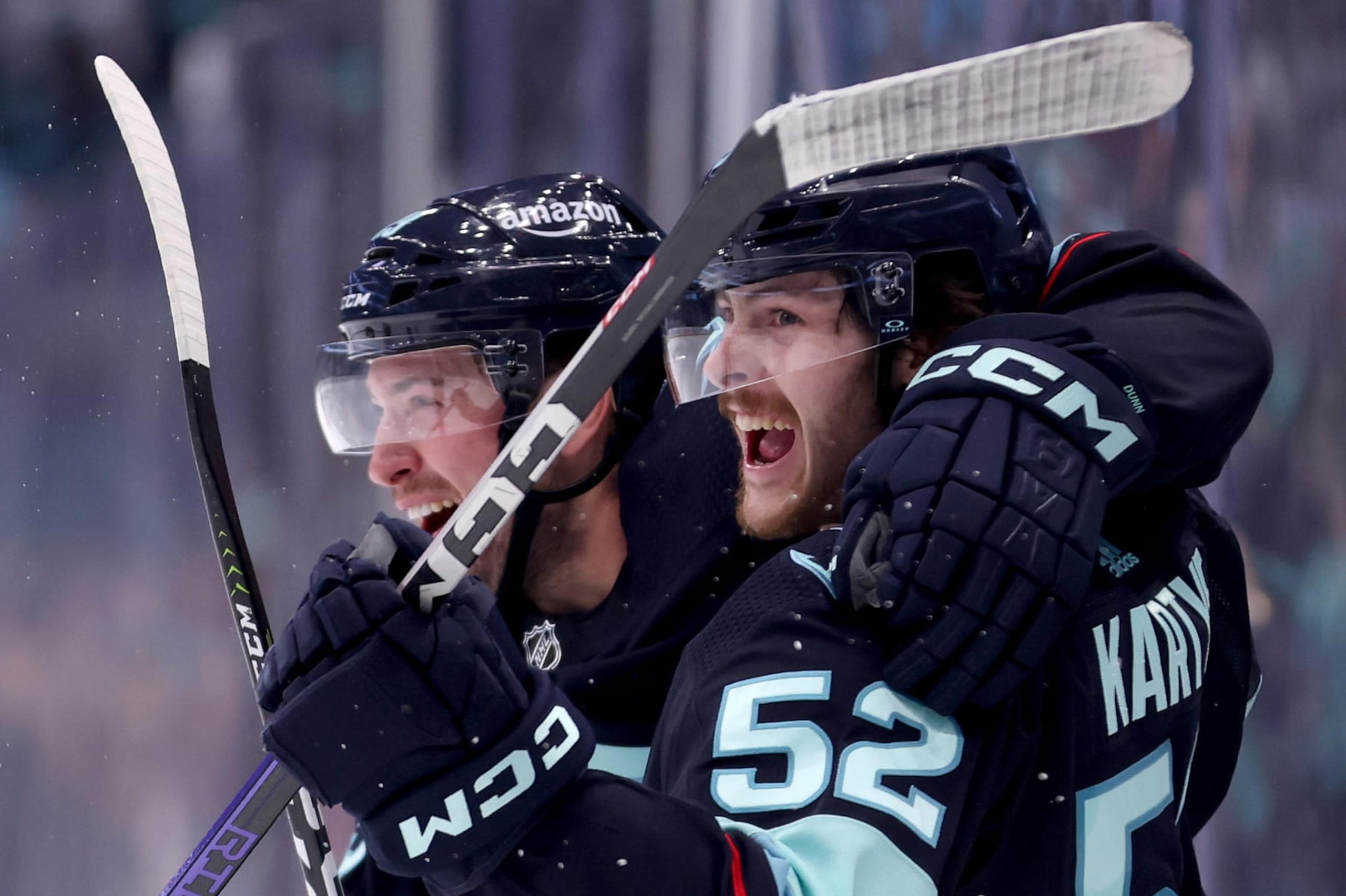 SEATTLE, WASHINGTON - MAY 13: Vince Dunn #29 and Tye Kartye #52 of the Seattle Kraken celebrate a goal by Kartye during the second period against the Dallas Stars in Game Six of the Second Round of the 2023 Stanley Cup Playoffs at Climate Pledge Arena on May 13, 2023 in Seattle, Washington. (Photo by Steph Chambers/Getty Images)