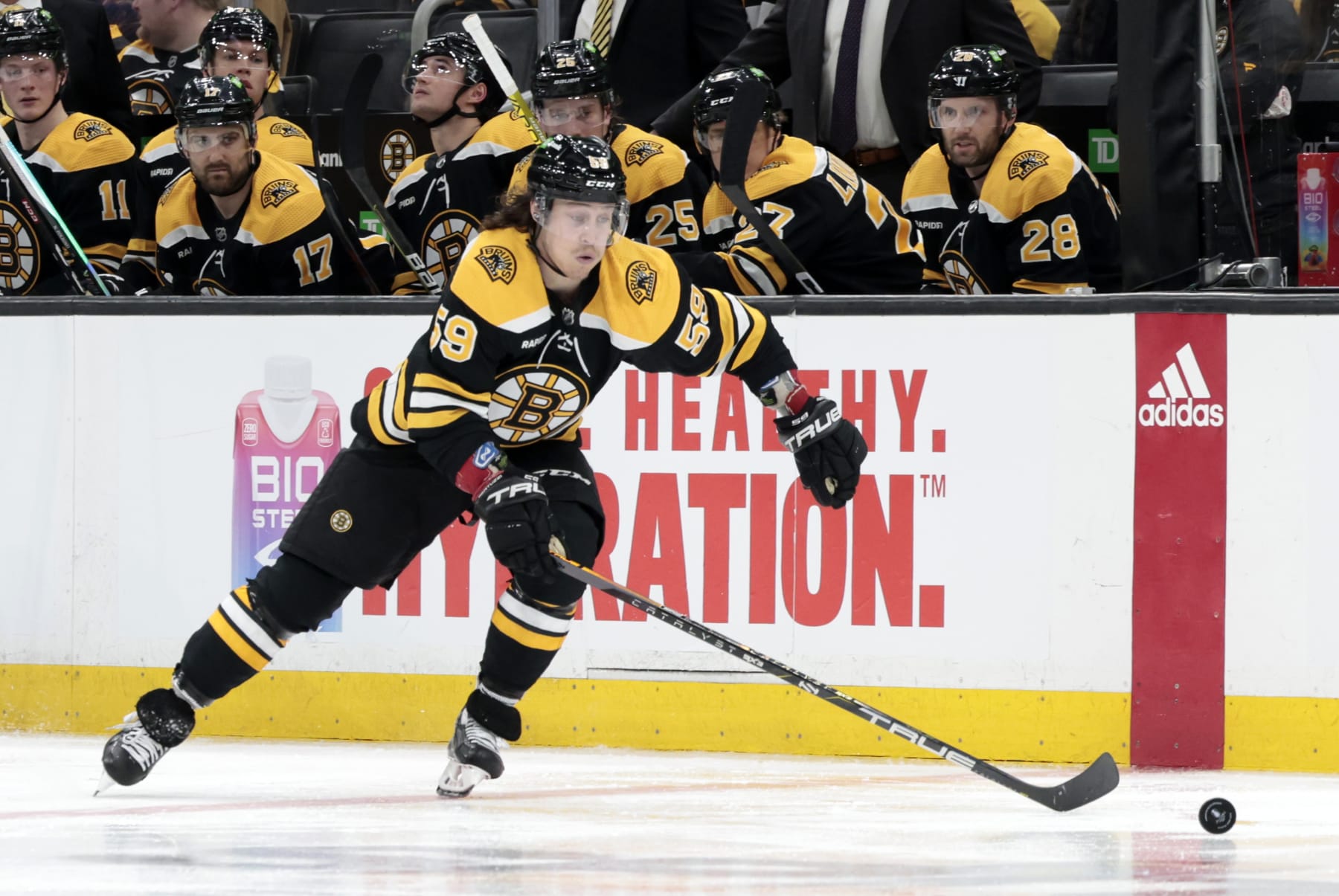 BOSTON, MA - APRIL 17: Boston Bruins right wing Tyler Bertuzzi (59) picks up the puck during Game 1 of an Eastern Conference First Round playoff contest between the Boston Bruins and the Florida Panthers on April 17, 2023, at TD Garden in Boston, Massachusetts. (Photo by Fred Kfoury III/Icon Sportswire via Getty Images)