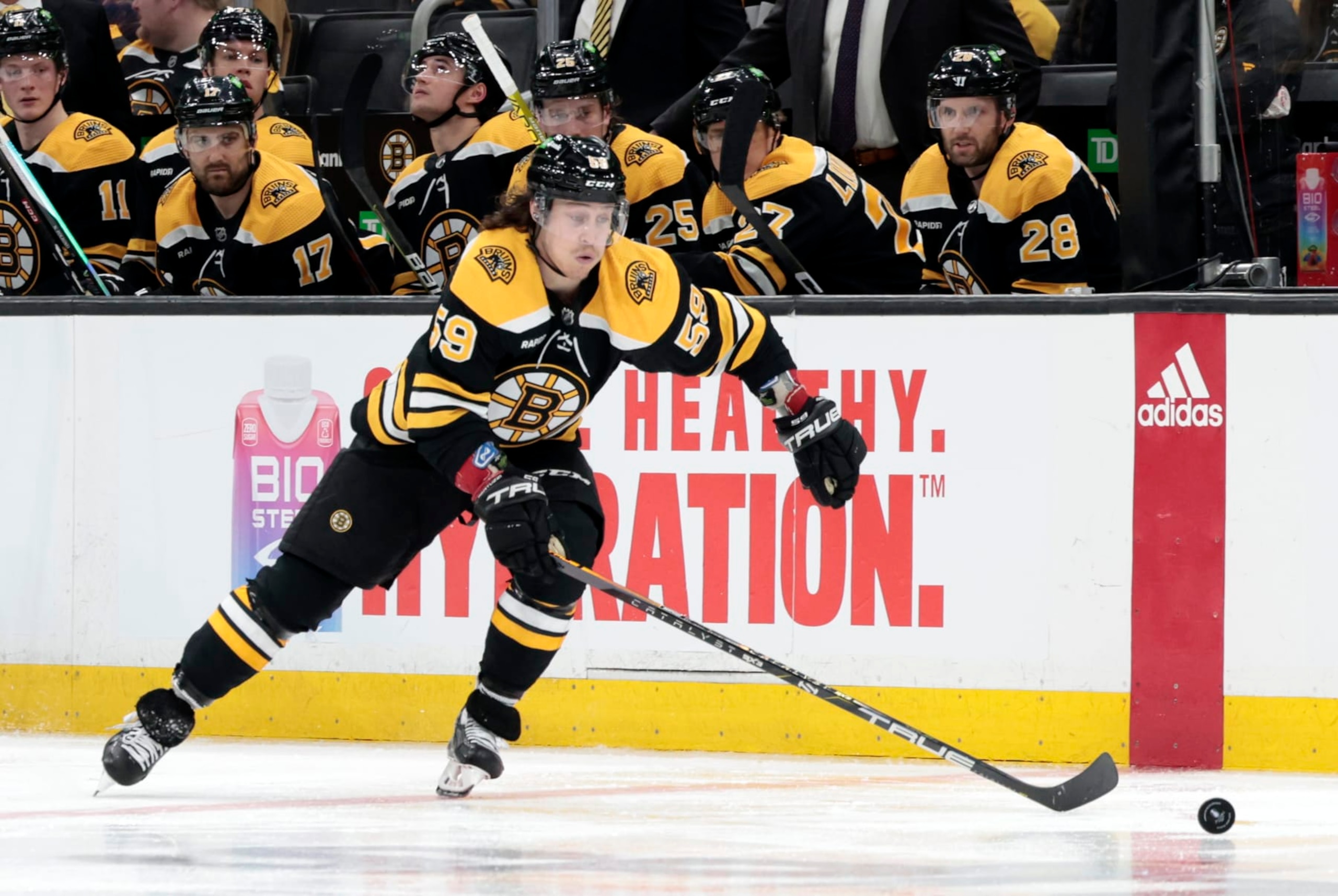 BOSTON, MA - APRIL 17: Boston Bruins right wing Tyler Bertuzzi (59) picks up the puck during Game 1 of an Eastern Conference First Round playoff contest between the Boston Bruins and the Florida Panthers on April 17, 2023, at TD Garden in Boston, Massachusetts. (Photo by Fred Kfoury III/Icon Sportswire via Getty Images)