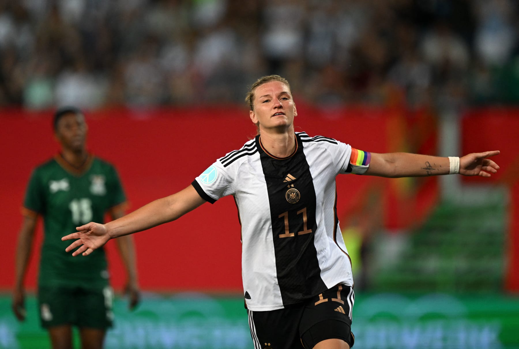 Germany's forward Alexandra Popp celebrates scoring the 2-2 goal with her team-mates during the International friendly football match Germany vs Zambia in Fuerth, southern Germany, on July 7, 2023, ahead of the FIFA Women's World Cup. (Photo by CHRISTOF STACHE / AFP) (Photo by CHRISTOF STACHE/AFP via Getty Images)