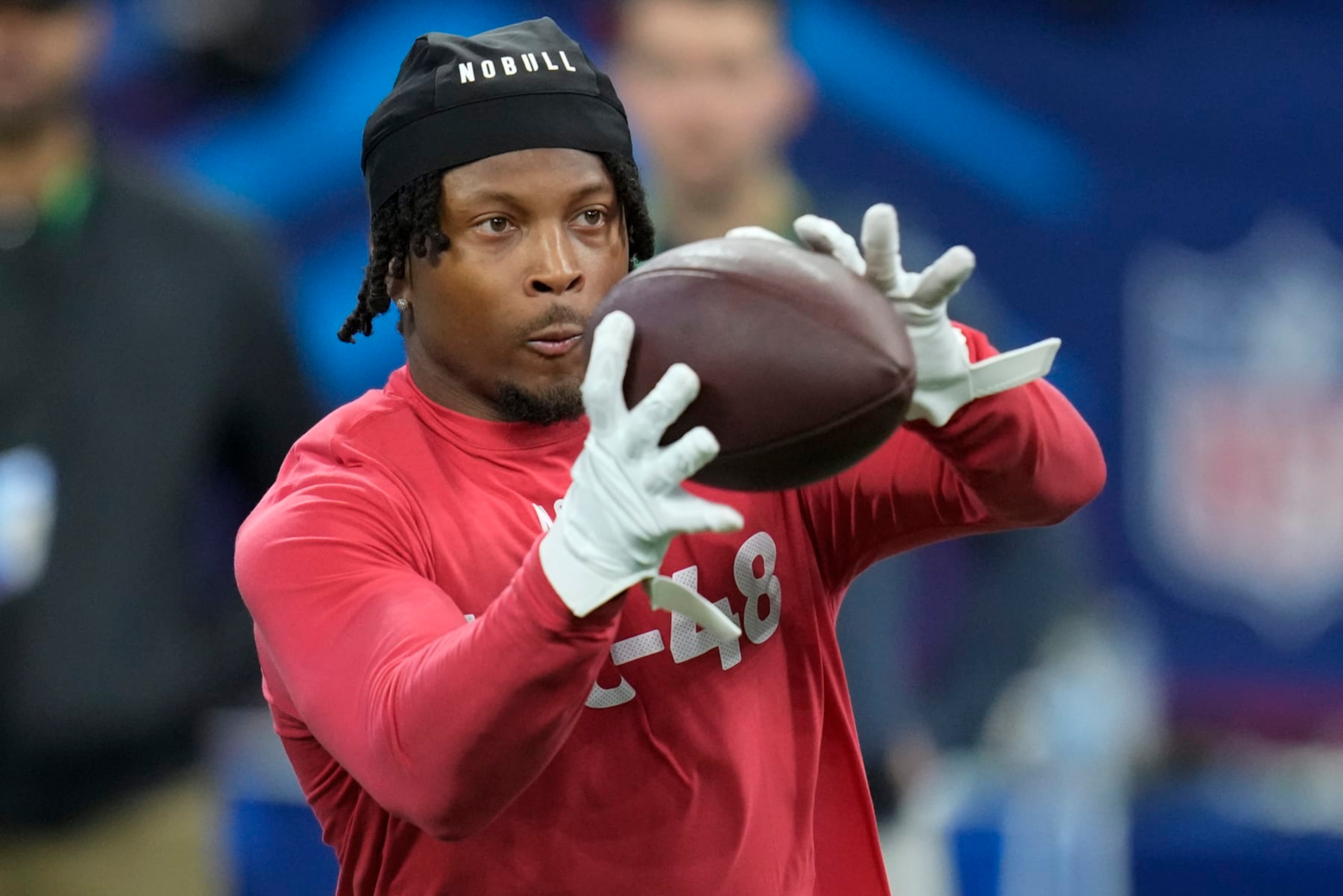 Cincinnati wide receiver Tre Tucker runs a drill at the NFL football scouting combine in Indianapolis, Saturday, March 4, 2023. (AP Photo/Michael Conroy)