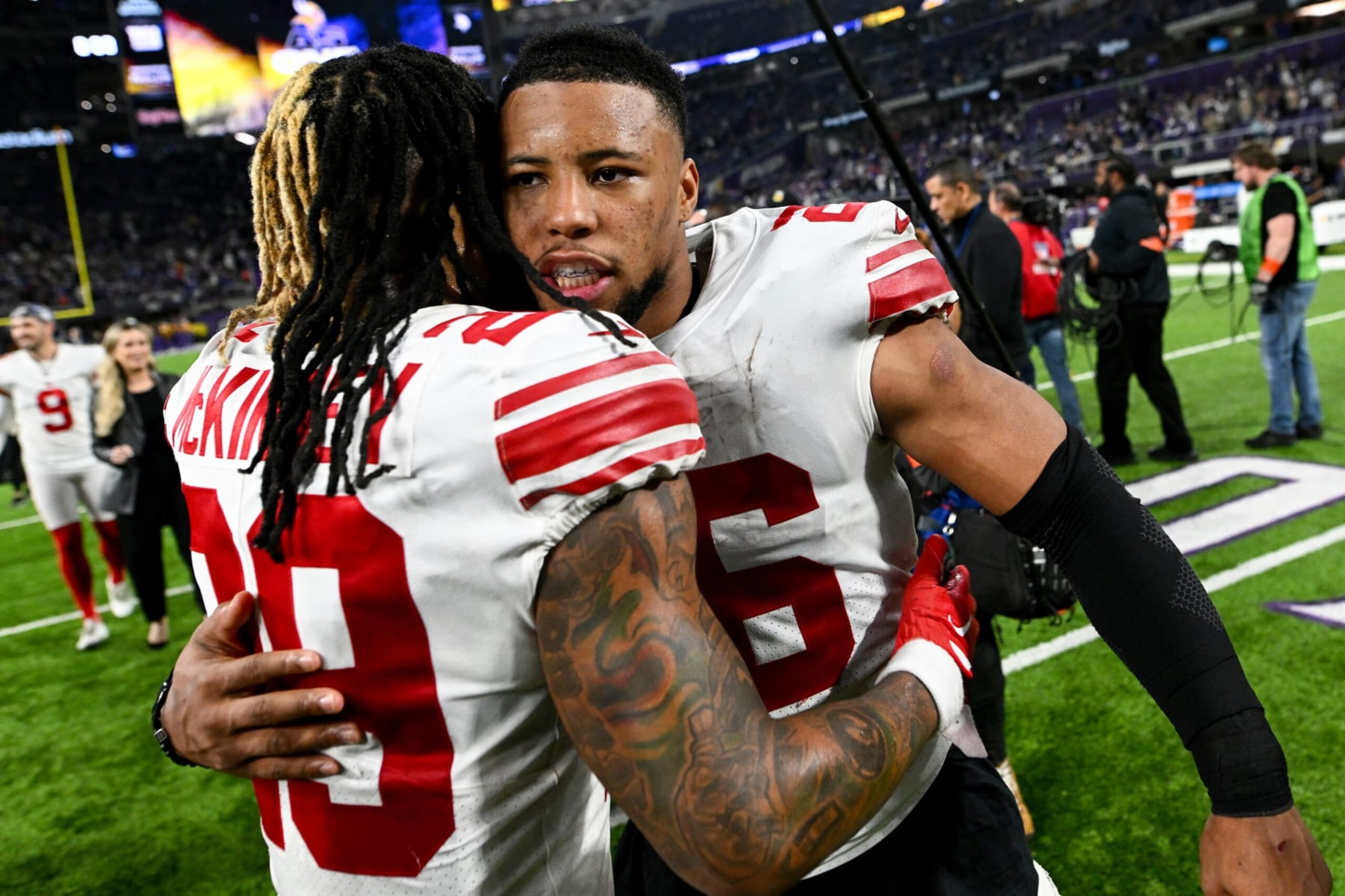 MINNEAPOLIS, MINNESOTA - JANUARY 15: Saquon Barkley #26 and Xavier McKinney #29 of the New York Giants celebrate after defeating the Minnesota Vikings in the NFC Wild Card playoff game at U.S. Bank Stadium on January 15, 2023 in Minneapolis, Minnesota. (Photo by Stephen Maturen/Getty Images)