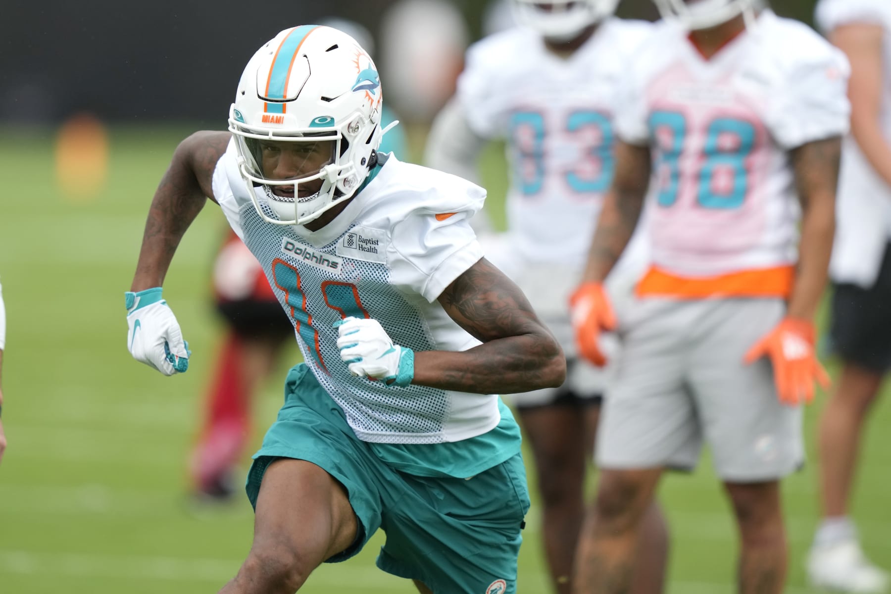 Miami Dolphins wide receiver Cedrick Wilson Jr. (11) runs drills during practice at the NFL football team's training facility, Tuesday, June 6, 2023, in Miami Gardens, Fla. (AP Photo/Lynne Sladky)