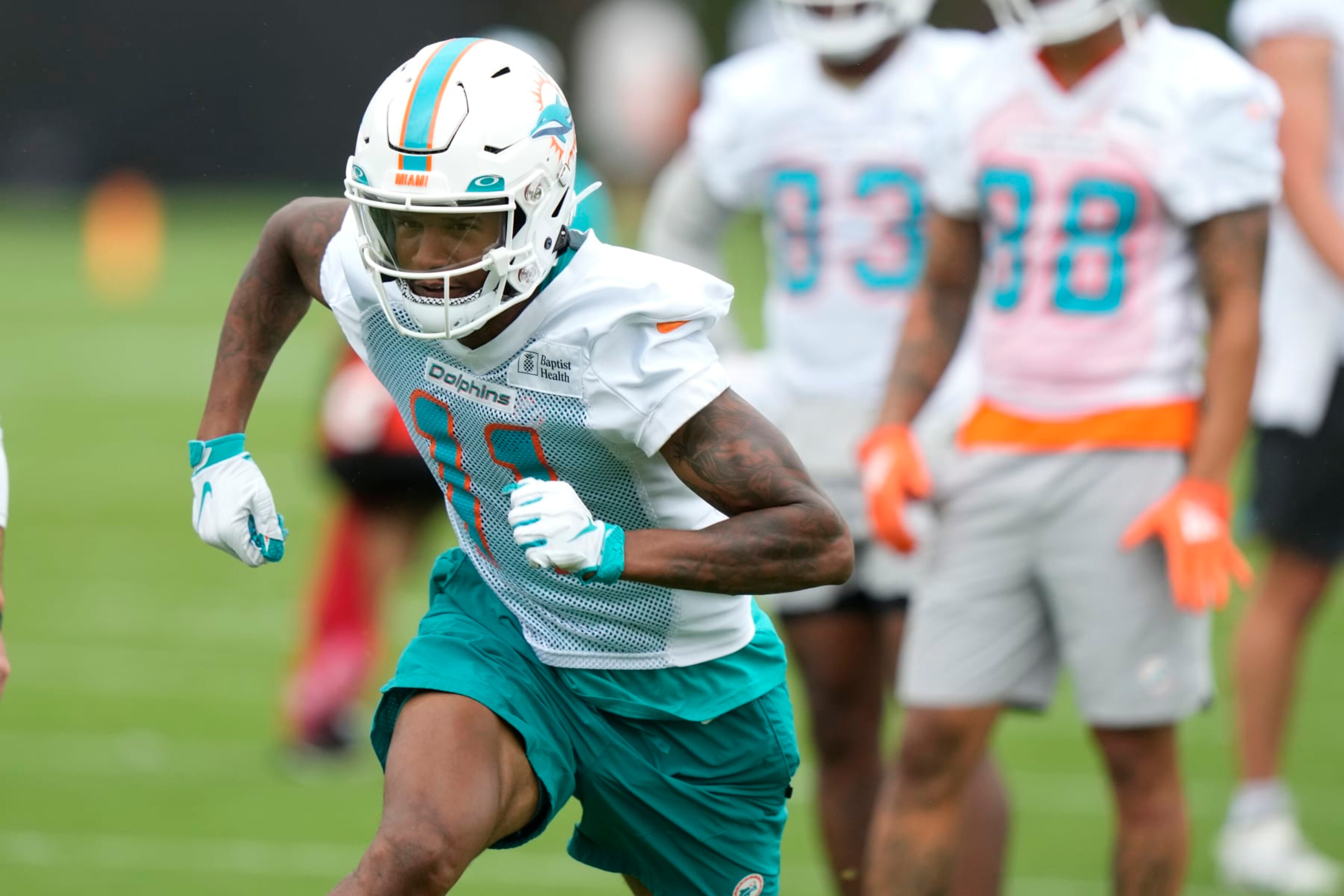 Miami Dolphins wide receiver Cedrick Wilson Jr. (11) runs drills during practice at the NFL football team's training facility, Tuesday, June 6, 2023, in Miami Gardens, Fla. (AP Photo/Lynne Sladky) Miami Dolphins wide receiver Cedrick Wilson Jr. (11) runs drills during practice at the NFL football team's training facility, Tuesday, June 6, 2023, in Miami Gardens, Fla. (AP Photo/Lynne Sladky)