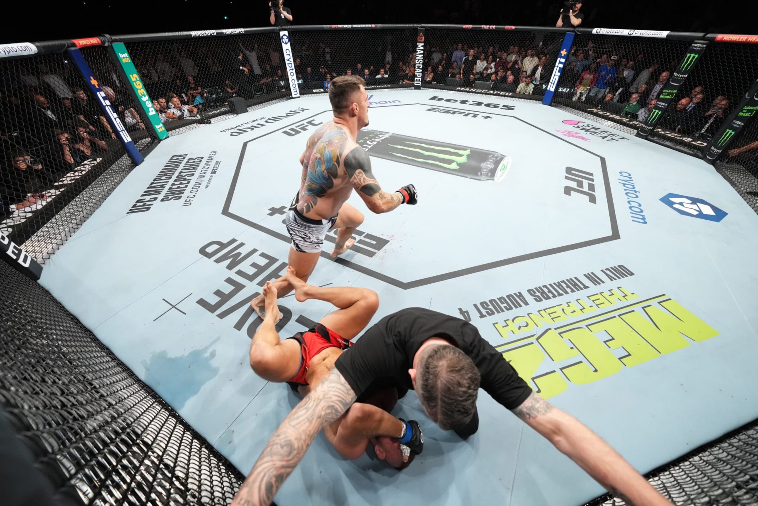 LONDON, ENGLAND - JULY 22: (L-R) Tom Aspinall of England finishes Marcin Tybura of Poland with punches in their heavyweight fight during the UFC Fight Night at The O2 Arena on July 22, 2023 in London, England. (Photo by Chris Unger/Zuffa LLC via Getty Images)