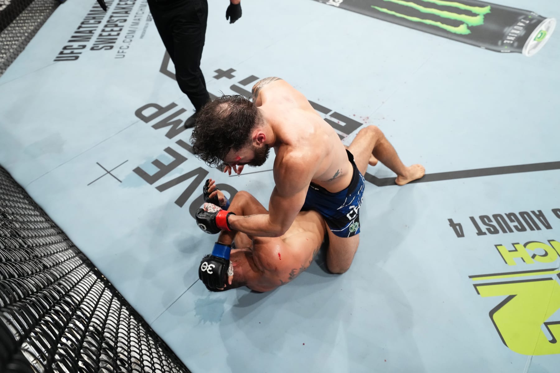 LONDON, ENGLAND - JULY 22: (R-L) Paul Craig of Scotland punches Andre Muniz of Brazil in their middleweight fight during the UFC Fight Night at The O2 Arena on July 22, 2023 in London, England. (Photo by Chris Unger/Zuffa LLC via Getty Images)