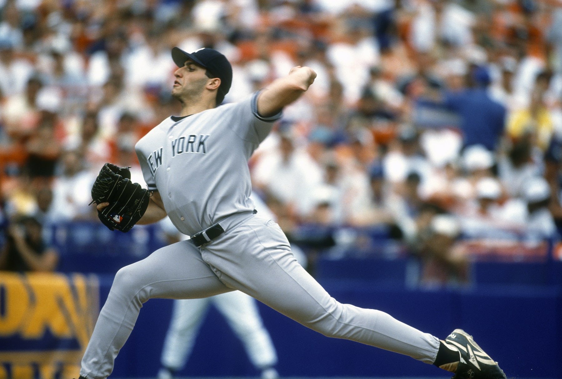 NEW YORK - CIRCA 1996:  Andy Pettitte #46 of the New York Yankees pitches against the New York Mets during an Major League Baseball game circa 1996 at Shea Stadium in the Queens borough of New York City. Pettitte played for the Yankees from 1995-2003, 2007-2010, 2012-2013. (Photo by Focus on Sport/Getty Images)