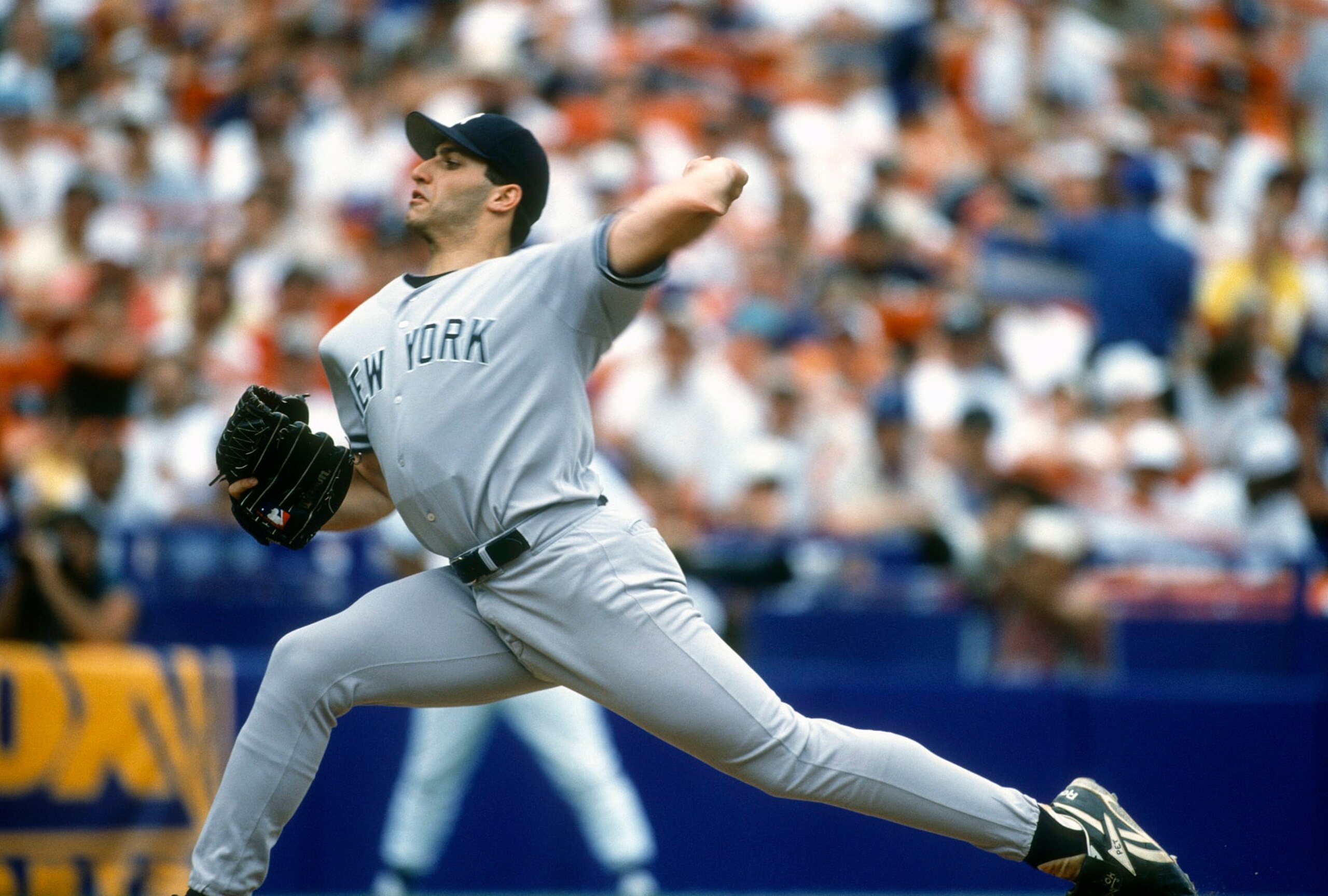NEW YORK - CIRCA 1996:  Andy Pettitte #46 of the New York Yankees pitches against the New York Mets during an Major League Baseball game circa 1996 at Shea Stadium in the Queens borough of New York City. Pettitte played for the Yankees from 1995-2003, 2007-2010, 2012-2013. (Photo by Focus on Sport/Getty Images)