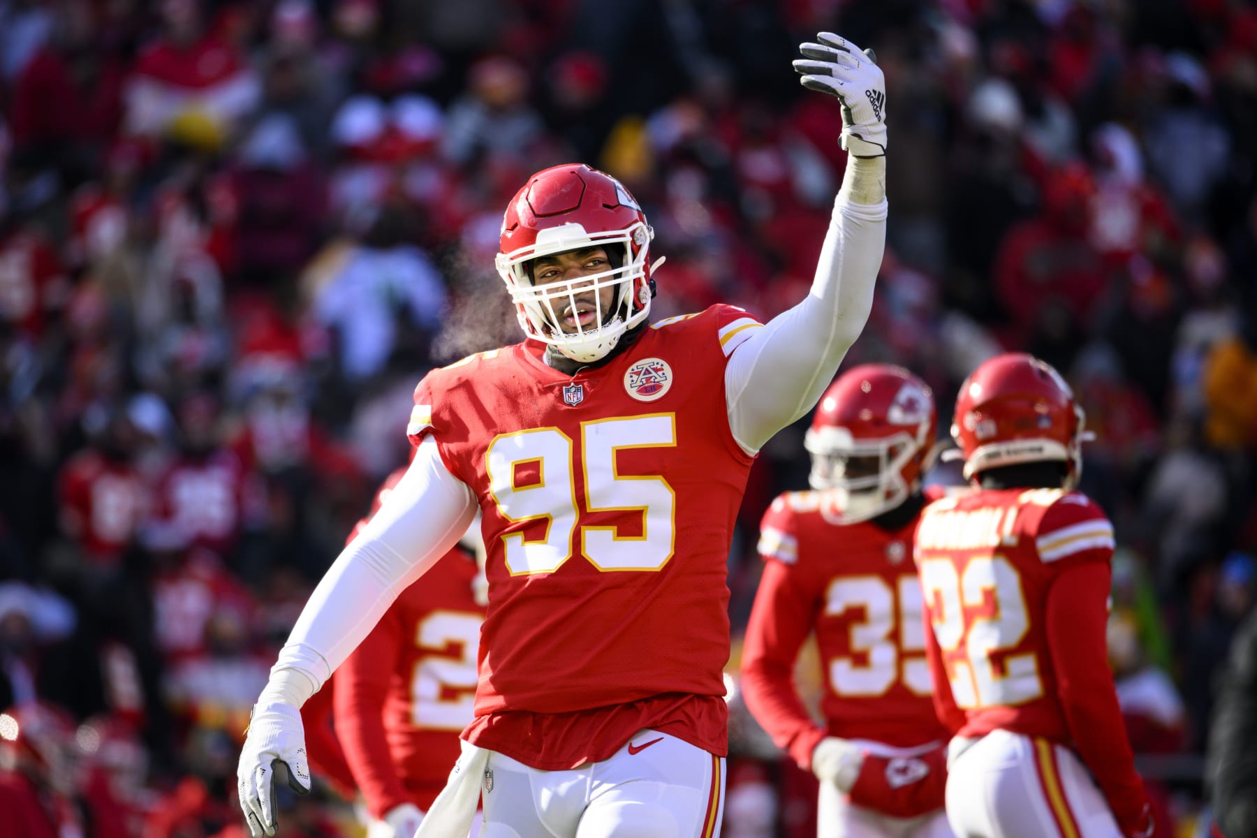 Kansas City Chiefs defensive tackle Chris Jones (95) urges the crowd to make noise during the first half of an NFL football game against the Seattle Seahawks, Saturday, Dec. 24, 2022 in Kansas City, Mo. (AP Photo/Reed Hoffmann)