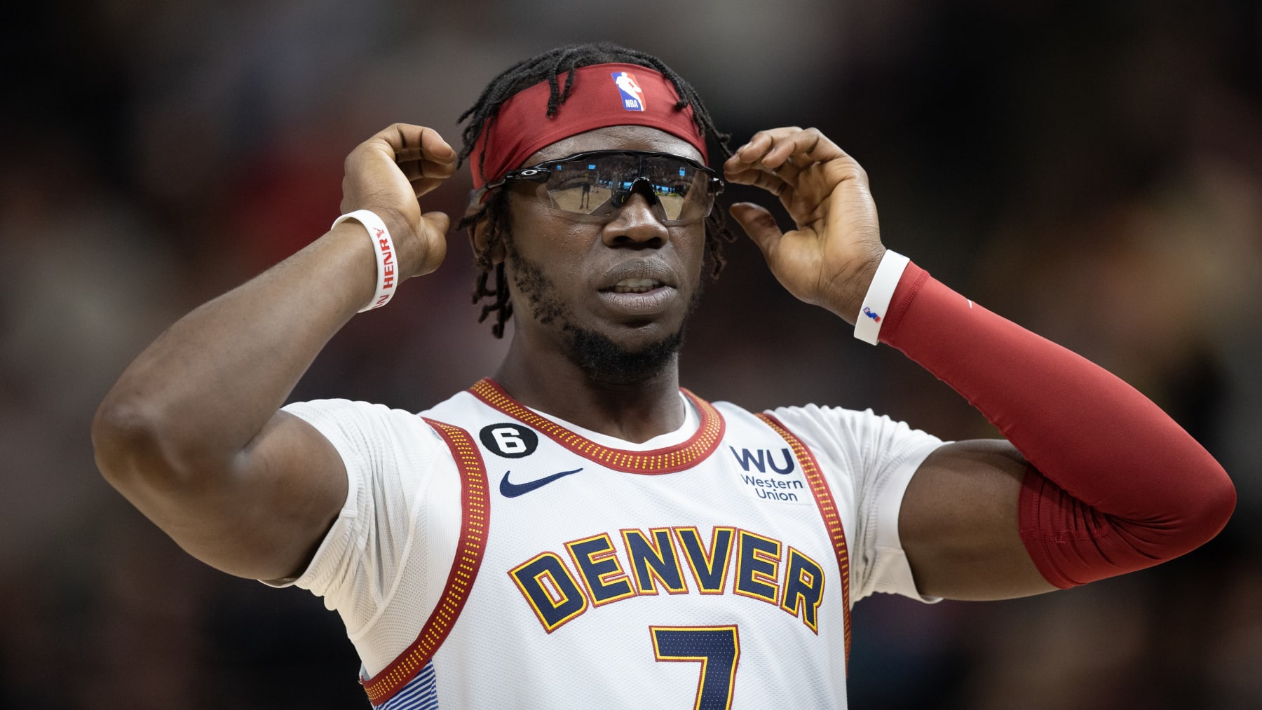 SALT LAKE CITY UT- APRIL 8 :  Reggie Jackson #7 of the Denver Nuggets adjusts his glasses during the first half of their game against the Utah Jazz April 8, 2023 at the Vivint Arena  in Salt Lake City Utah. NOTE TO USER: User expressly acknowledges and agrees that, by downloading and using this photograph, User is consenting to the terms and conditions of the Getty Images License Agreement(Photo by Chris Gardner/ Getty Images)
