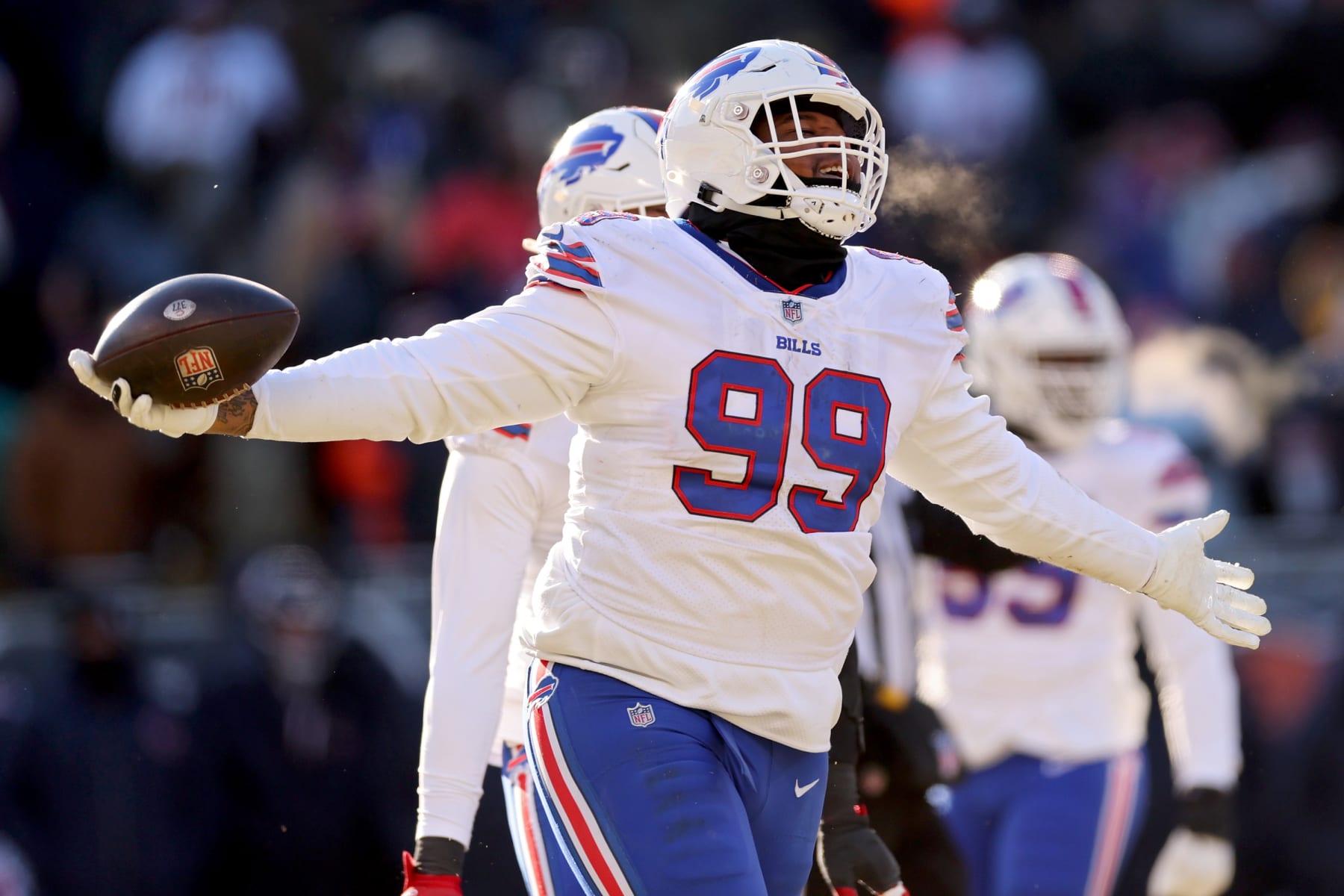 CHICAGO, ILLINOIS - DECEMBER 24: Tim Settle #99 of the Buffalo Bills celebrates a recovered fumble during the third quarter in the game against the Chicago Bears at Soldier Field on December 24, 2022 in Chicago, Illinois. (Photo by Michael Reaves/Getty Images)