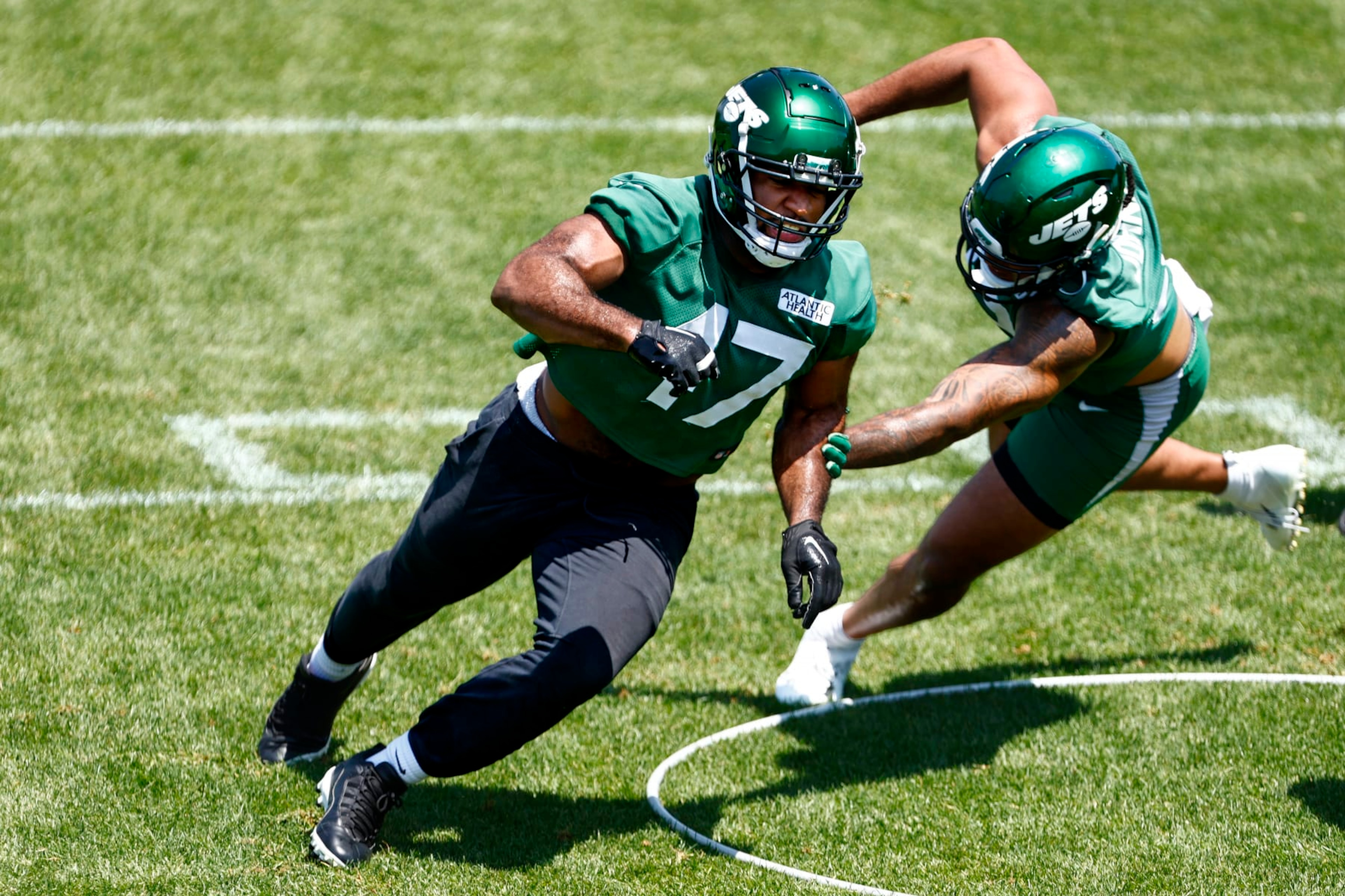 FLORHAM PARK, NEW JERSEY - MAY 31: Bryce Huff #47 and Jermaine Johnson #52 of the New York Jets run a drill during the teams OTAs at Atlantic Health Jets Training Center on May 31, 2023 in Florham Park, New Jersey. (Photo by Rich Schultz/Getty Images) FLORHAM PARK, NEW JERSEY - MAY 31: Bryce Huff #47 and Jermaine Johnson #52 of the New York Jets run a drill during the teams OTAs at Atlantic Health Jets Training Center on May 31, 2023 in Florham Park, New Jersey. (Photo by Rich Schultz/Getty Images)