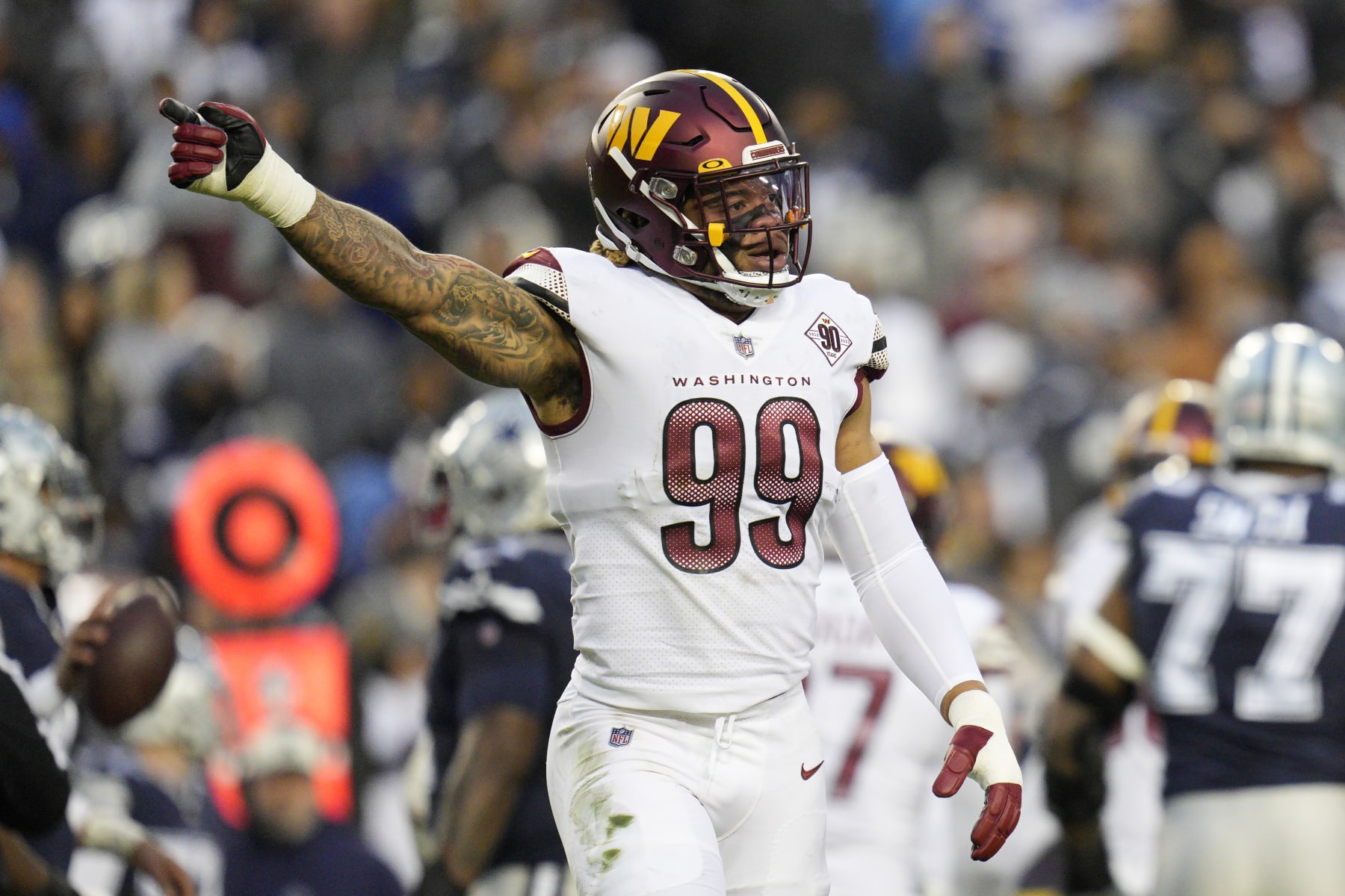 LANDOVER, MARYLAND - JANUARY 08: Chase Young #99 of the Washington Commanders looks on during the first half of the game against the Dallas Cowboys at FedExField on January 08, 2023 in Landover, Maryland. (Photo by Jess Rapfogel/Getty Images)