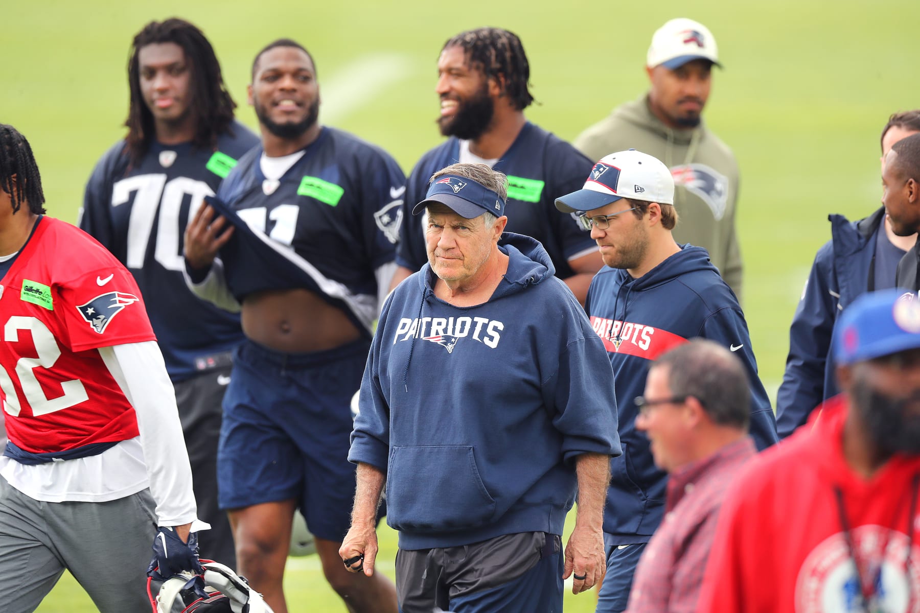 Foxborough, MA - June 9: New England Patriots head coach Bill Belichick walks off the practice field surrounded by his players. (Photo by John Tlumacki/The Boston Globe via Getty Images)