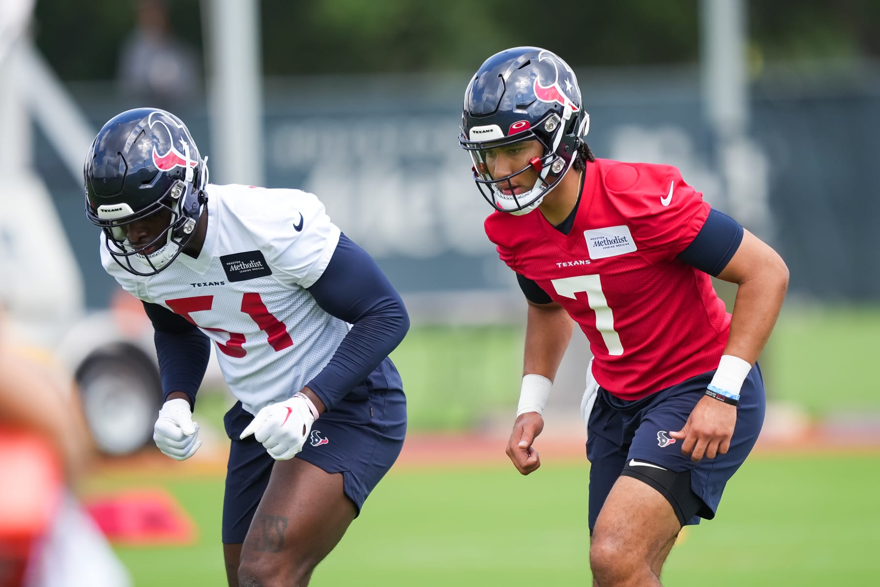 HOUSTON, TEXAS - MAY 12: Quarterback C.J Stroud #7 and Linebacker Will Anderson Jr. #51 of the Houston Texans warm up during the first day of Houston Texans Rookie Mini-camp at NRG Stadium on May 12, 2023 in Houston, Texas. (Photo by Alex Bierens de Haan/Getty Images)
