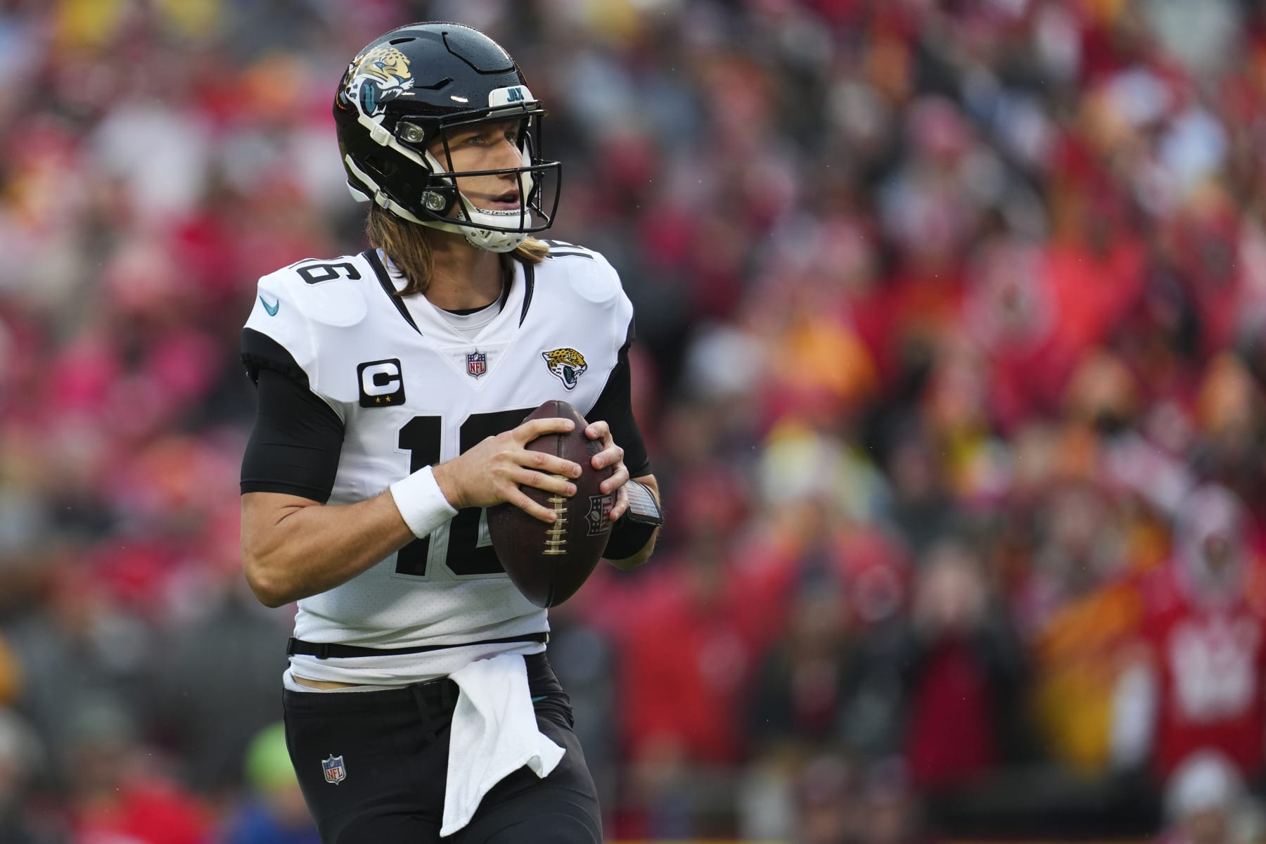 KANSAS CITY, MO - JANUARY 21: Trevor Lawrence #16 of the Jacksonville Jaguars drops back against the Kansas City Chiefs at GEHA Field at Arrowhead Stadium on January 21, 2023 in Kansas City, Missouri. (Photo by Cooper Neill/Getty Images)