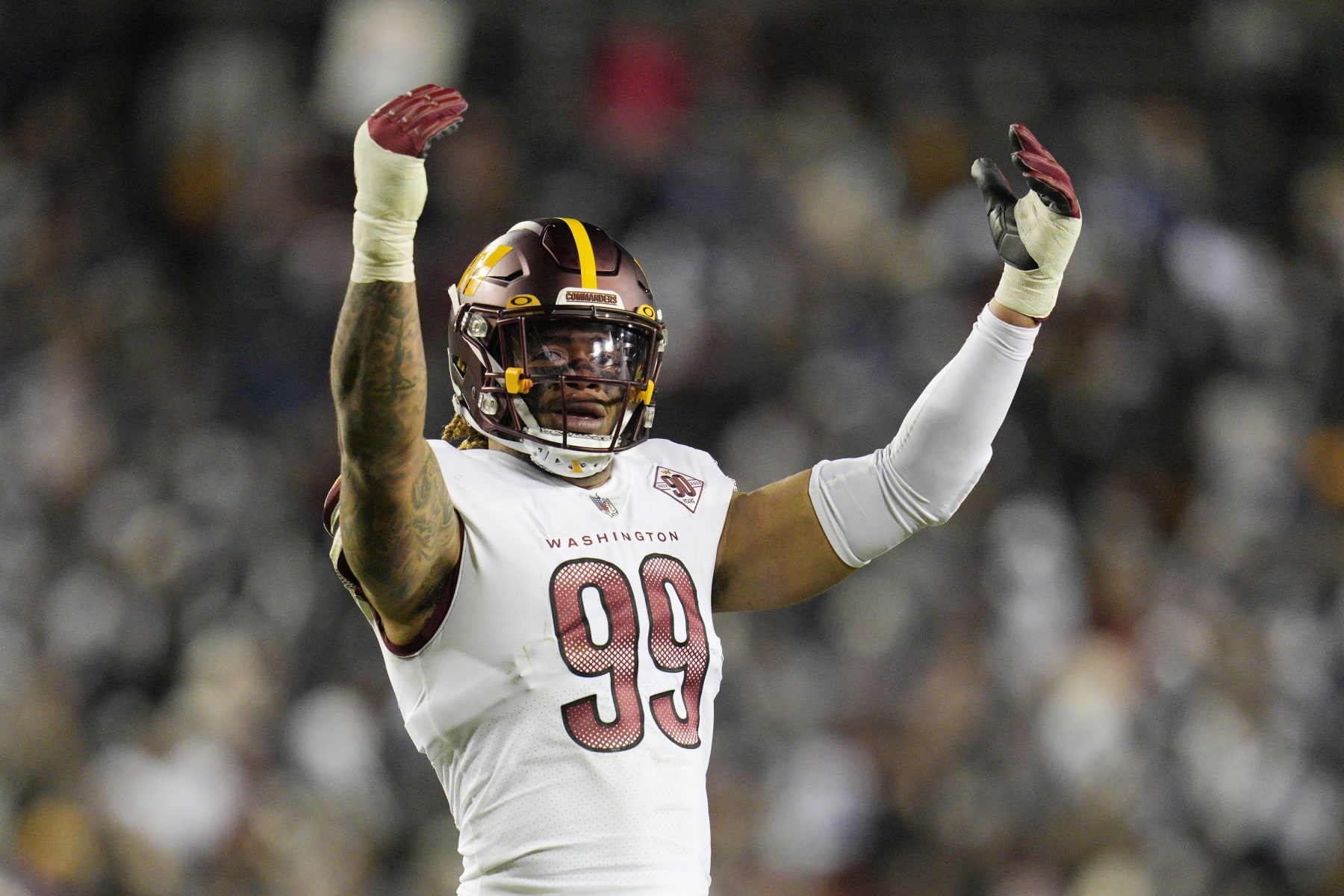 LANDOVER, MARYLAND - JANUARY 08: Chase Young #99 of the Washington Commanders looks on during the first half of the game against the Dallas Cowboys at FedExField on January 08, 2023 in Landover, Maryland. (Photo by Jess Rapfogel/Getty Images)