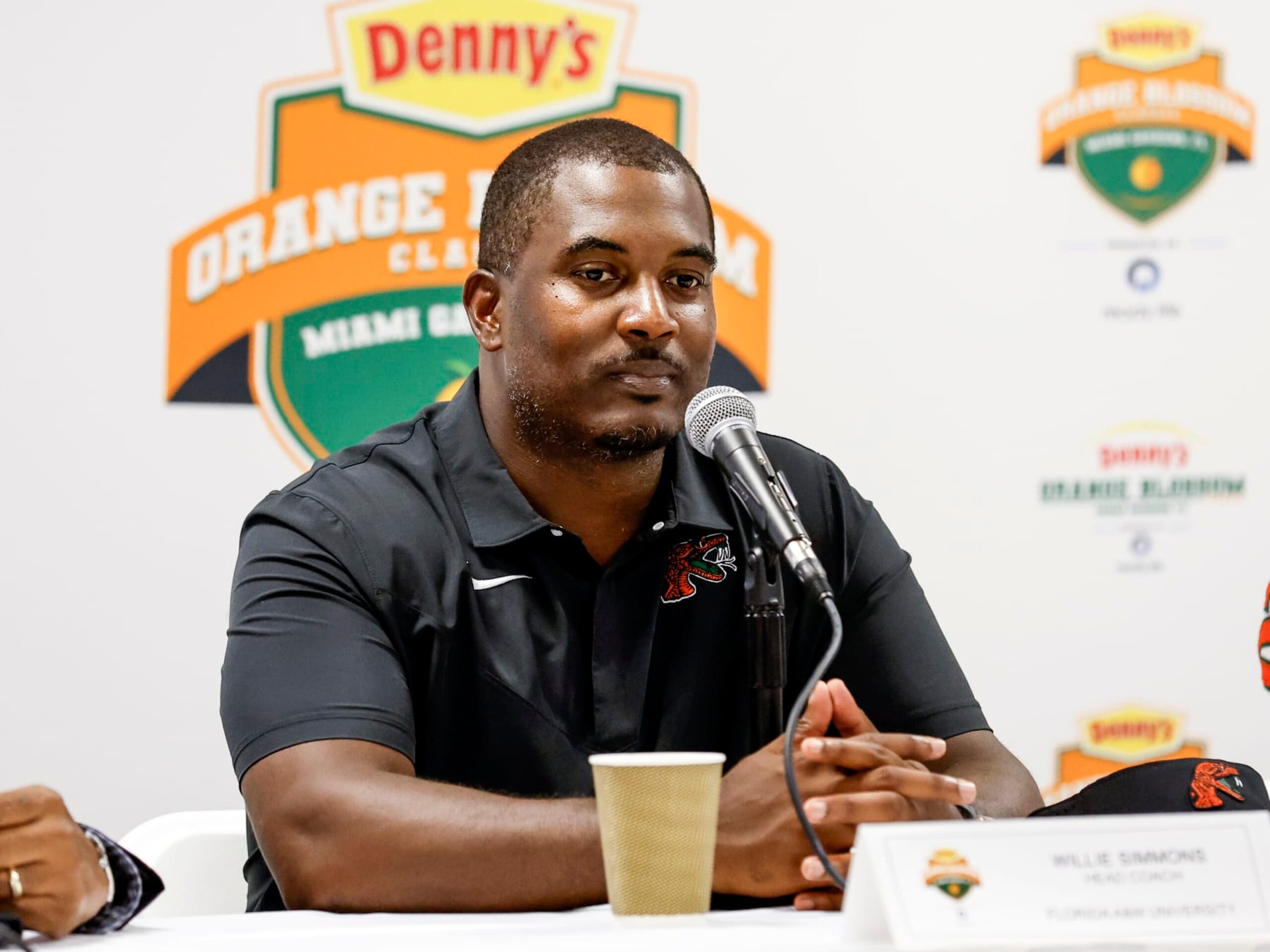 MIAMI GARDENS, FLORIDA - SEPTEMBER 04: Head Coach Willie Simmons of the Florida A&M Rattlers talk with the media during the post game press conference after the game against the Jackson State Tigers during the Denny's Orange Blossom Classic Game at Hard Rock Stadium on September 04, 2022 in Miami Gardens, Florida. The Tigers defeated the Rattlers 59 to 3. (Photo by Don Juan Moore/Getty Images) MIAMI GARDENS, FLORIDA - SEPTEMBER 04: Head Coach Willie Simmons of the Florida A&M Rattlers talk with the media during the post game press conference after the game against the Jackson State Tigers during the Denny's Orange Blossom Classic Game at Hard Rock Stadium on September 04, 2022 in Miami Gardens, Florida. The Tigers defeated the Rattlers 59 to 3. (Photo by Don Juan Moore/Getty Images)