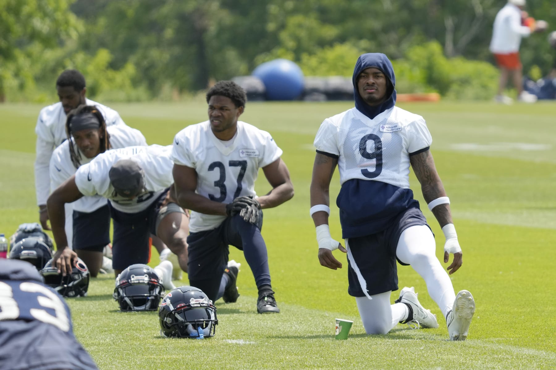 Chicago Bears defensive back Jaquan Brisker (9) work on the field with teammates during NFL football OTA practice in Lake Forest, Ill., Wednesday, June 7, 2023. (AP Photo/Nam Y. Huh)