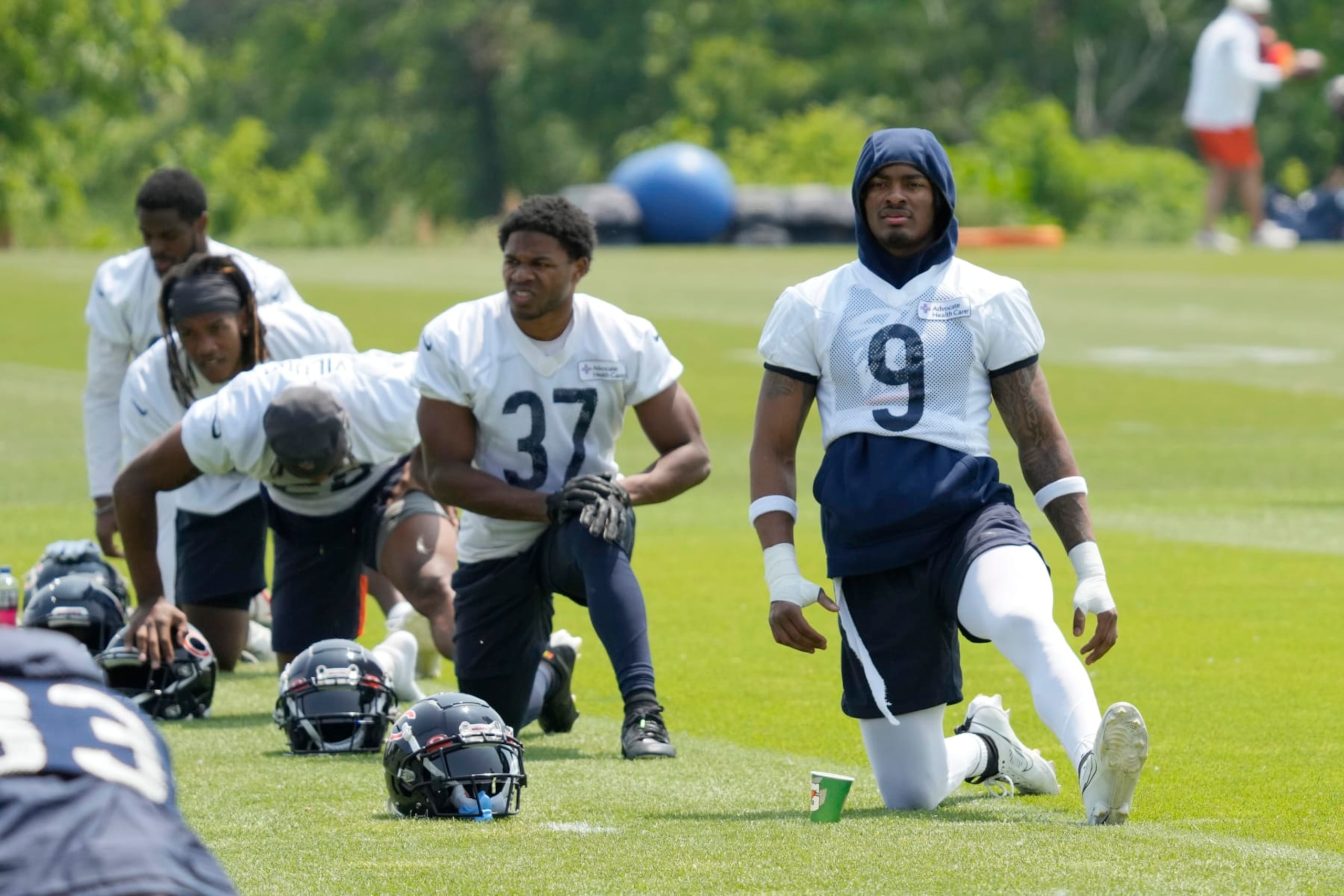 Chicago Bears defensive back Jaquan Brisker (9) work on the field with teammates during NFL football OTA practice in Lake Forest, Ill., Wednesday, June 7, 2023. (AP Photo/Nam Y. Huh)