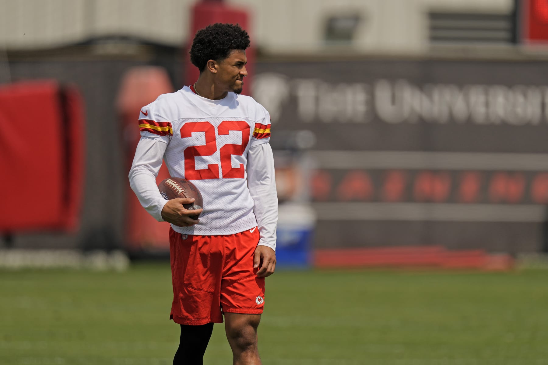 Kansas City Chiefs cornerback Trent McDuffie watches a drill during the NFL football team's organized team activities Thursday, June 1, 2023, in Kansas City, Mo. (AP Photo/Charlie Riedel)