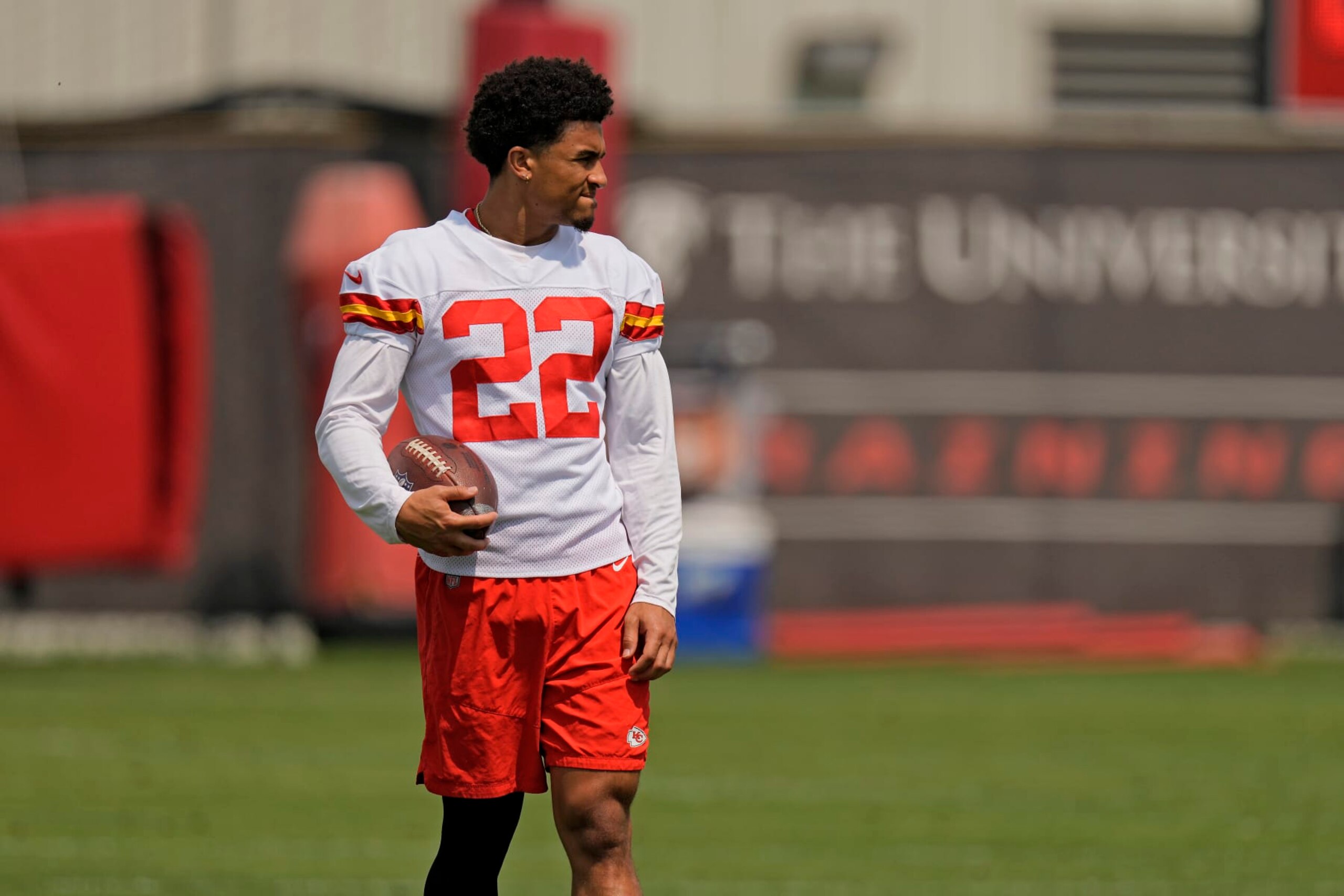 Kansas City Chiefs cornerback Trent McDuffie watches a drill during the NFL football team's organized team activities Thursday, June 1, 2023, in Kansas City, Mo. (AP Photo/Charlie Riedel)