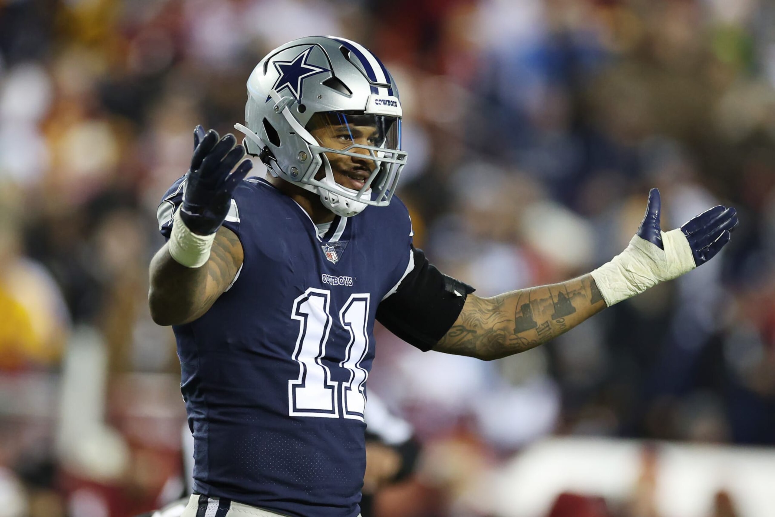 LANDOVER, MARYLAND - JANUARY 08: Micah Parsons #11 of the Dallas Cowboys looks on during the second half of the game against the Washington Commanders at FedExField on January 08, 2023 in Landover, Maryland. (Photo by Rob Carr/Getty Images)