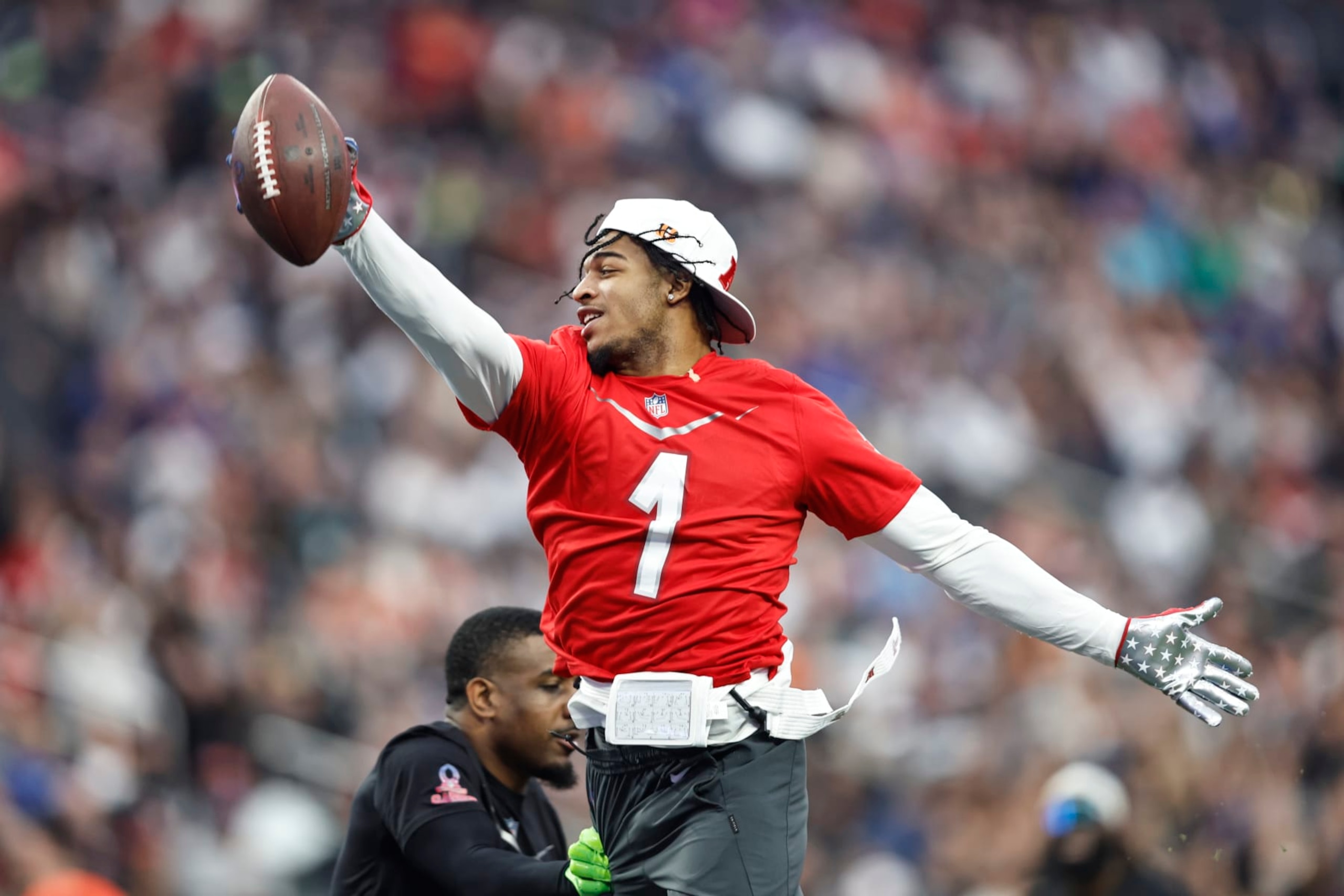 LAS VEGAS, NEVADA - FEBRUARY 05: LAS VEGAS, NEVADA - FEBRUARY 05: AFC wide receiver Ja'Marr Chase #1 of the Cincinnati Bengals jumps and reaches for a touchdown during an NFL Pro Bowl football game at Allegiant Stadium on February 05, 2023 in Las Vegas, Nevada. (Photo by Michael Owens/Getty Images)