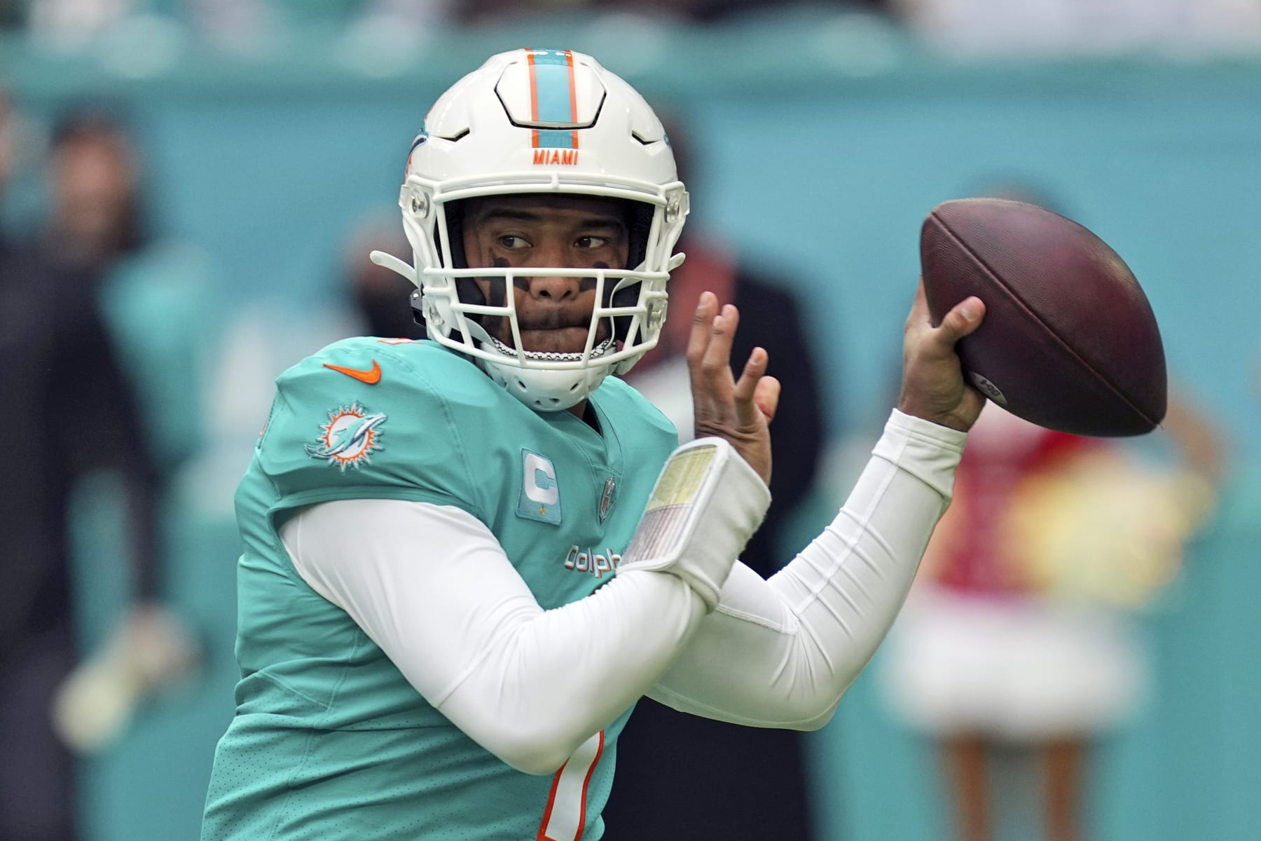 FILE - Miami Dolphins quarterback Tua Tagovailoa (1) looks to pass during the first half of an NFL football game against the Green Bay Packers, Sunday, Dec. 25, 2022, in Miami Gardens, Fla. The Dolphins are picking up the fifth-year option on Tagovailoa’s contract, a person familiar with the deal told The Associated Press Friday, March 10, 2023. The person spoke on condition of anonymity because the Dolphins had not officially announced the deal. (AP Photo/Jim Rassol, File)