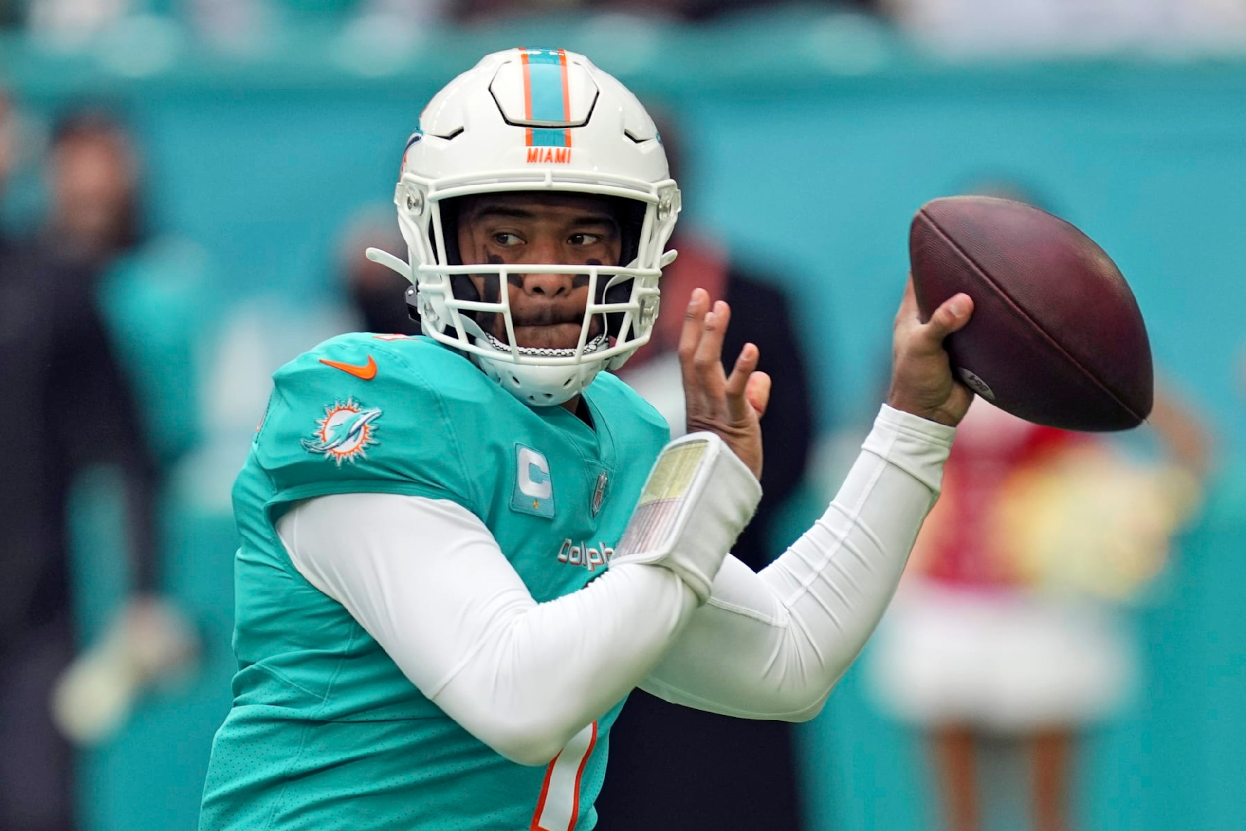 FILE - Miami Dolphins quarterback Tua Tagovailoa (1) looks to pass during the first half of an NFL football game against the Green Bay Packers, Sunday, Dec. 25, 2022, in Miami Gardens, Fla. The Dolphins are picking up the fifth-year option on Tagovailoa’s contract, a person familiar with the deal told The Associated Press Friday, March 10, 2023. The person spoke on condition of anonymity because the Dolphins had not officially announced the deal. (AP Photo/Jim Rassol, File)