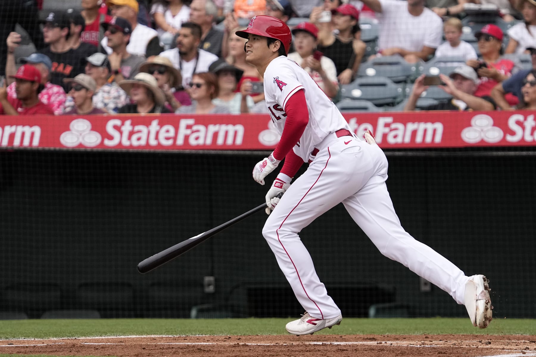 Los Angeles Angels' Shohei Ohtani heads to first base after hitting a solo home run during the first inning of a baseball game against the Pittsburgh Pirates, Sunday, July 23, 2023, in Anaheim, Calif. (AP Photo/Mark J. Terrill)