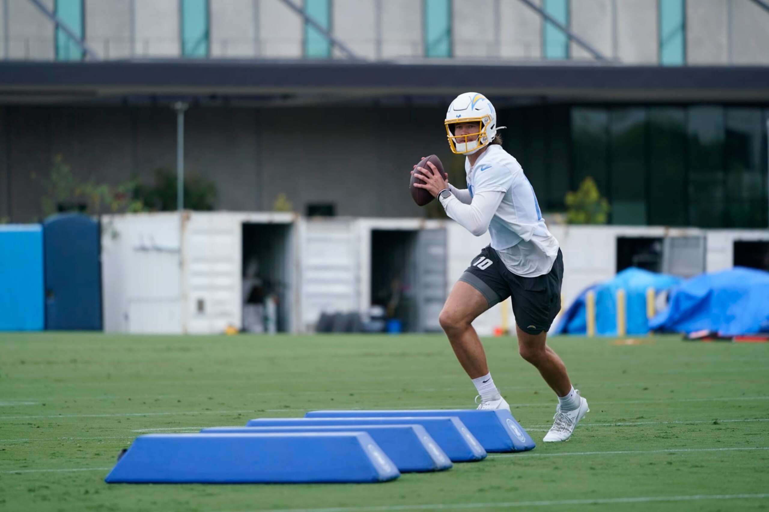 Los Angeles Chargers quarterback Justin Herbert (10) runs a drill during the NFL football team's camp in Costa Mesa, Calif., Wednesday, June 14, 2023. (AP Photo/Jae C. Hong)