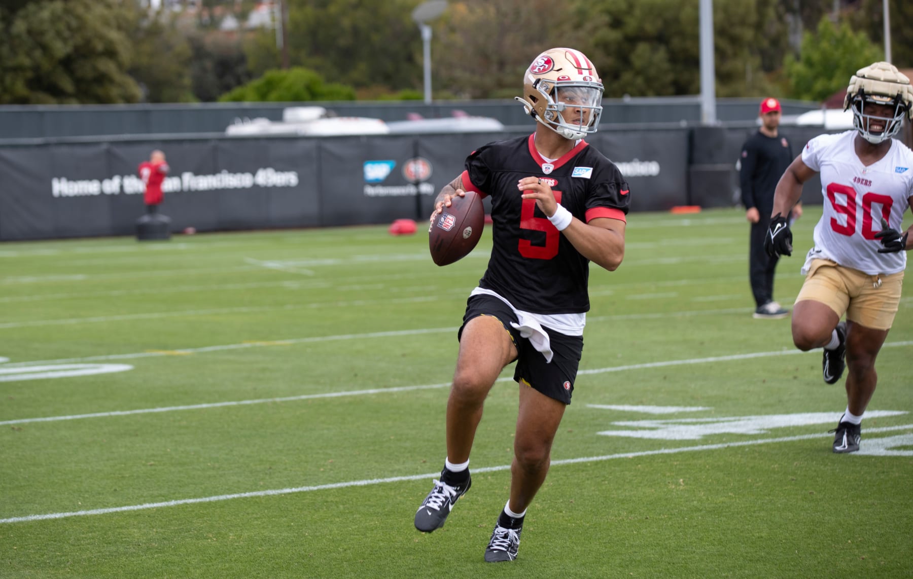 SANTA CLARA, CA - JUNE 7: Trey Lance #5 of the San Francisco 49ers rolls out during mandatory minicamp at the SAP Performance Facility on June 7, 2023 in Santa Clara, California.  (Photo by Michael Zagaris/San Francisco 49ers/Getty Images)