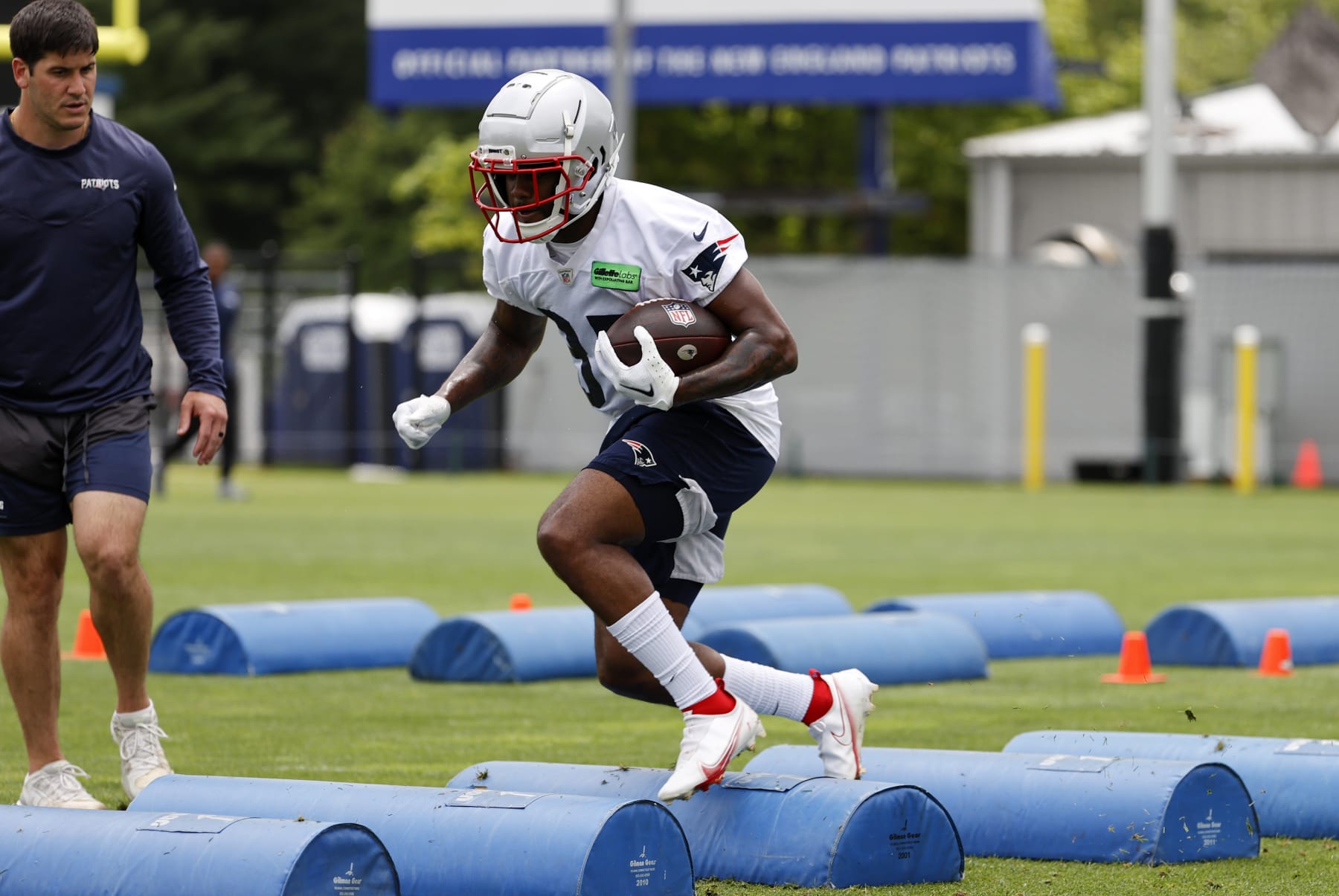 FOXBOROUGH, MA - JUNE 13: New England Patriots running back Pierre Strong Jr. (35) carries the ball over the speed bumps during New England Patriots Minicamp on June 13, 2023, at the Patriots Practice Facility at Gillette Stadium in Foxborough, Massachusetts. (Photo by Fred Kfoury III/Icon Sportswire via Getty Images)