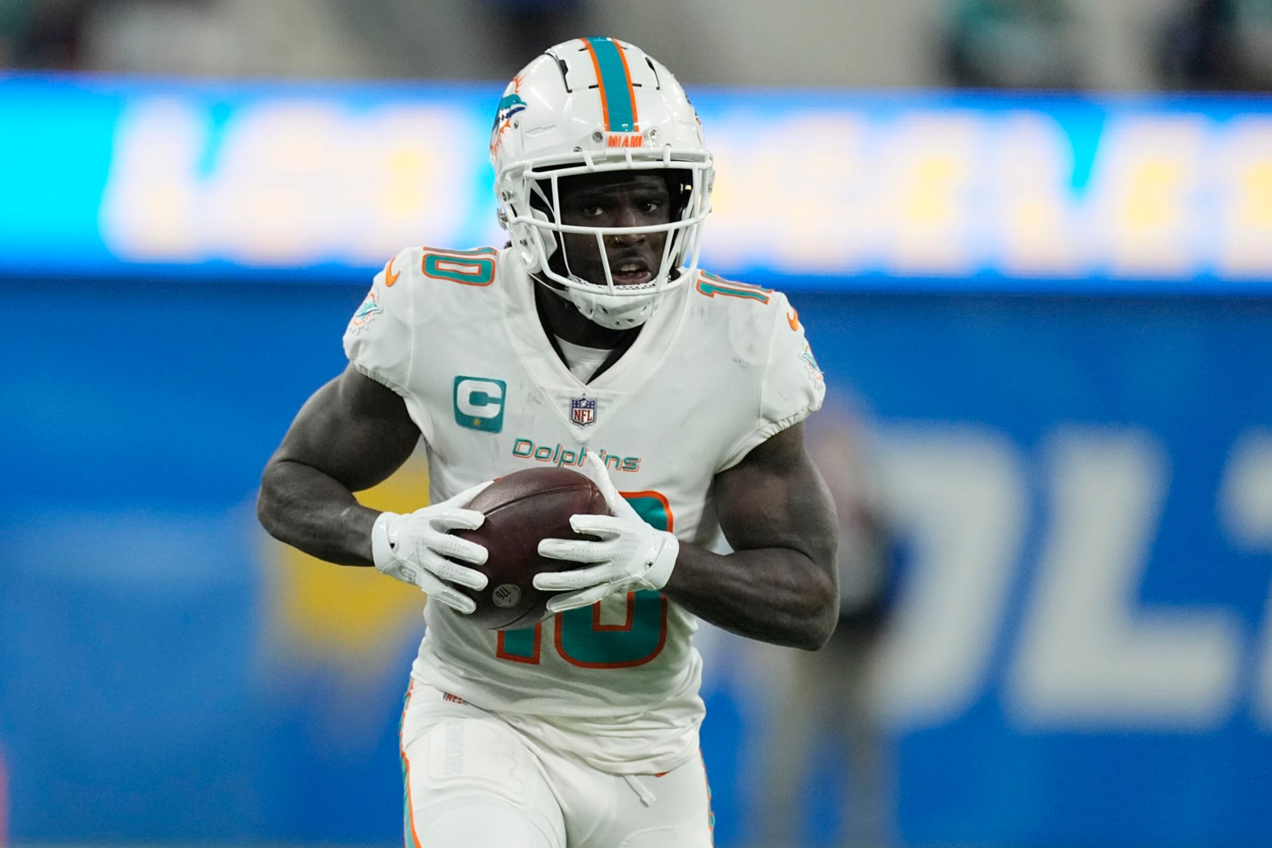 Miami Dolphins wide receiver Tyreek Hill catches a touchdown during the second half of an NFL football game against the Los Angeles Chargers Sunday, Dec. 11, 2022, in Inglewood, Calif. (AP Photo/Mark J. Terrill)