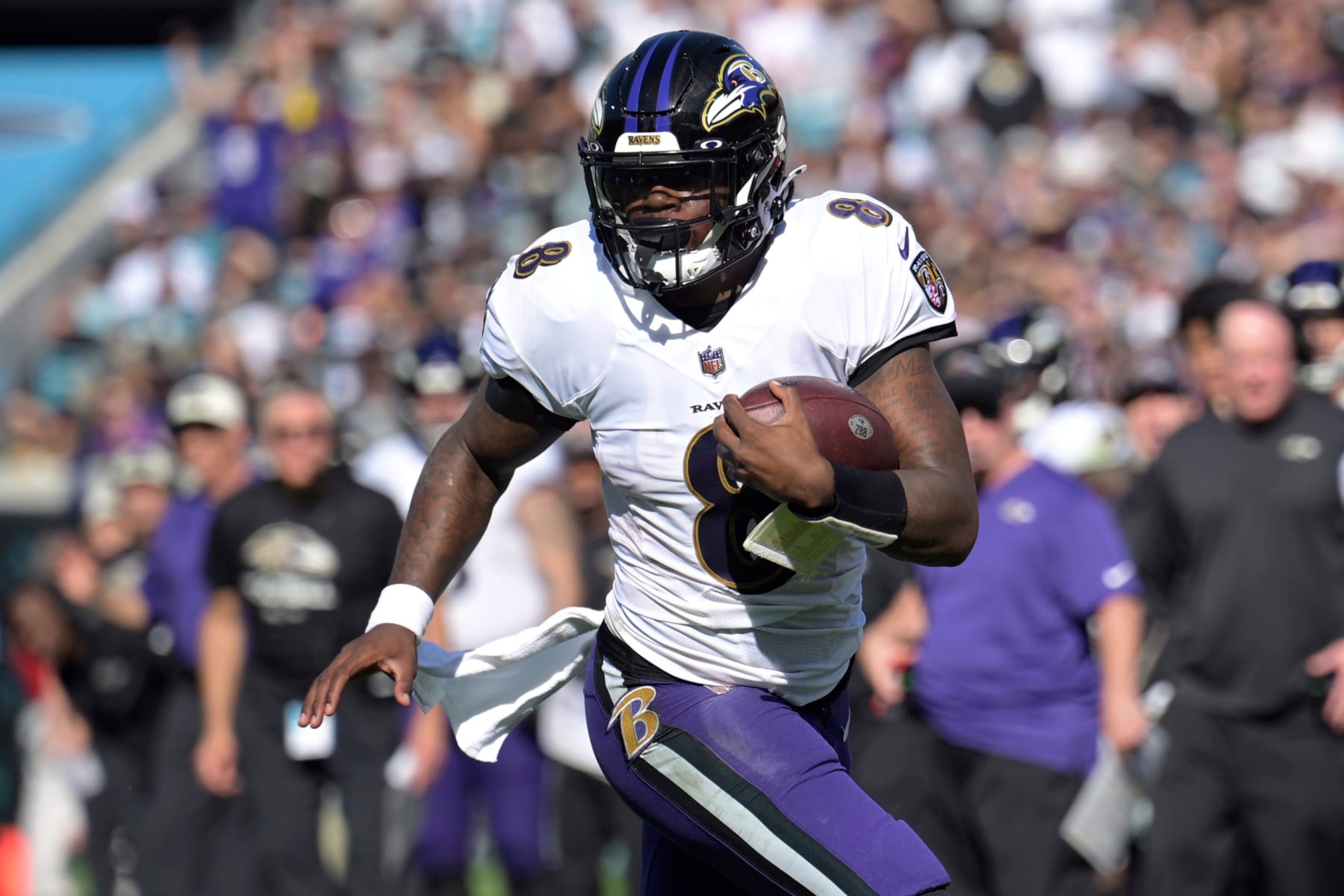 FILE - Baltimore Ravens quarterback Lamar Jackson (8) scrambles for yardage during the first half of an NFL football game the Jacksonville Jaguars, Sunday, Nov. 27, 2022, in Jacksonville, Fla. The Ravens agreed in principle with Jackson on a five-year deal Thursday, April 27, 2023, securing their star quarterback for the foreseeable future and ending a contract negotiation saga that was dominating the team's offseason. (AP Photo/Phelan M. Ebenhack, File) FILE - Baltimore Ravens quarterback Lamar Jackson (8) scrambles for yardage during the first half of an NFL football game the Jacksonville Jaguars, Sunday, Nov. 27, 2022, in Jacksonville, Fla. The Ravens agreed in principle with Jackson on a five-year deal Thursday, April 27, 2023, securing their star quarterback for the foreseeable future and ending a contract negotiation saga that was dominating the team's offseason. (AP Photo/Phelan M. Ebenhack, File)