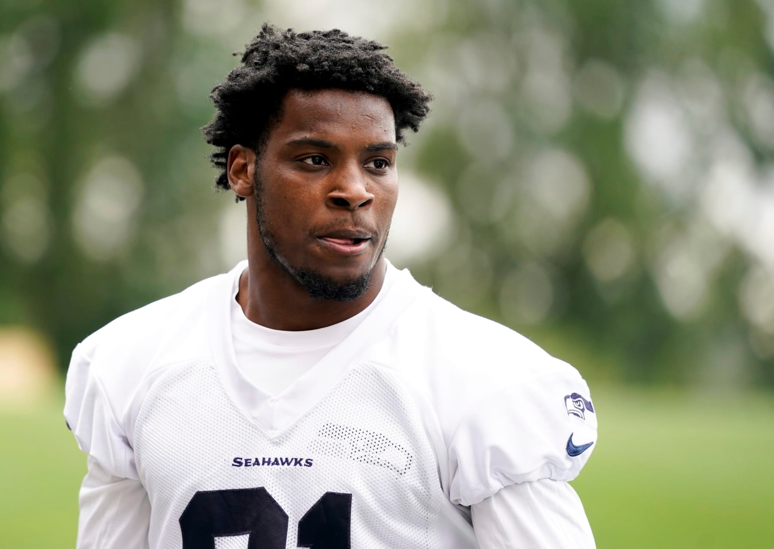 Seattle Seahawks cornerback Devon Witherspoon walks off the field after participating in drills, Monday, May 22, 2023, at the team's NFL football training facility in Renton, Wash. (AP Photo/Lindsey Wasson)